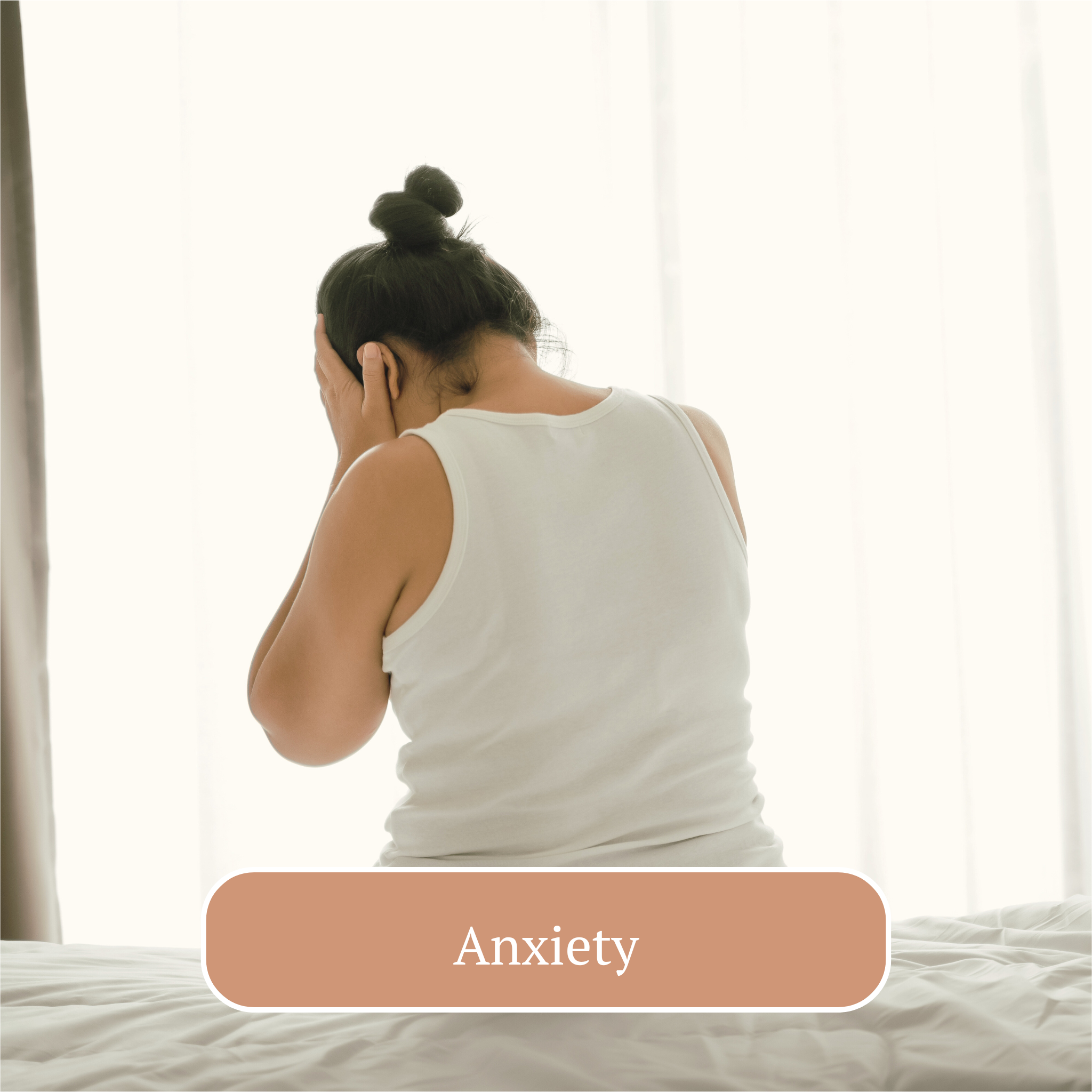 A woman sitting on a bed holding her head in her hands, indicating distress or discomfort, with the word 'Anxiety' written at the bottom, suggesting she is experiencing anxiety.