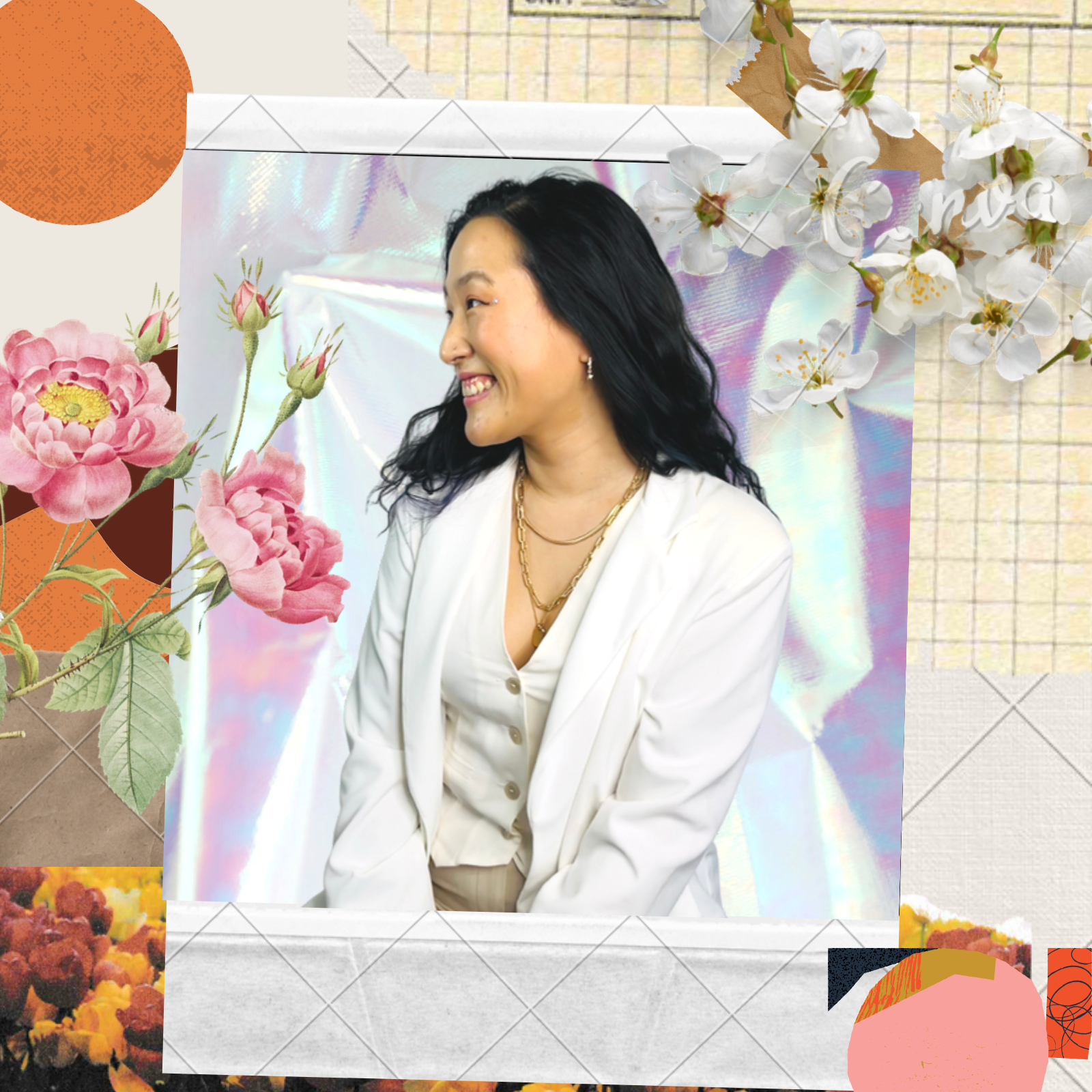 A woman with black hair, wearing a white blazer and gold jewelry, smiling and looking to her left. She is surrounded by pink and white flowers and a holographic background.