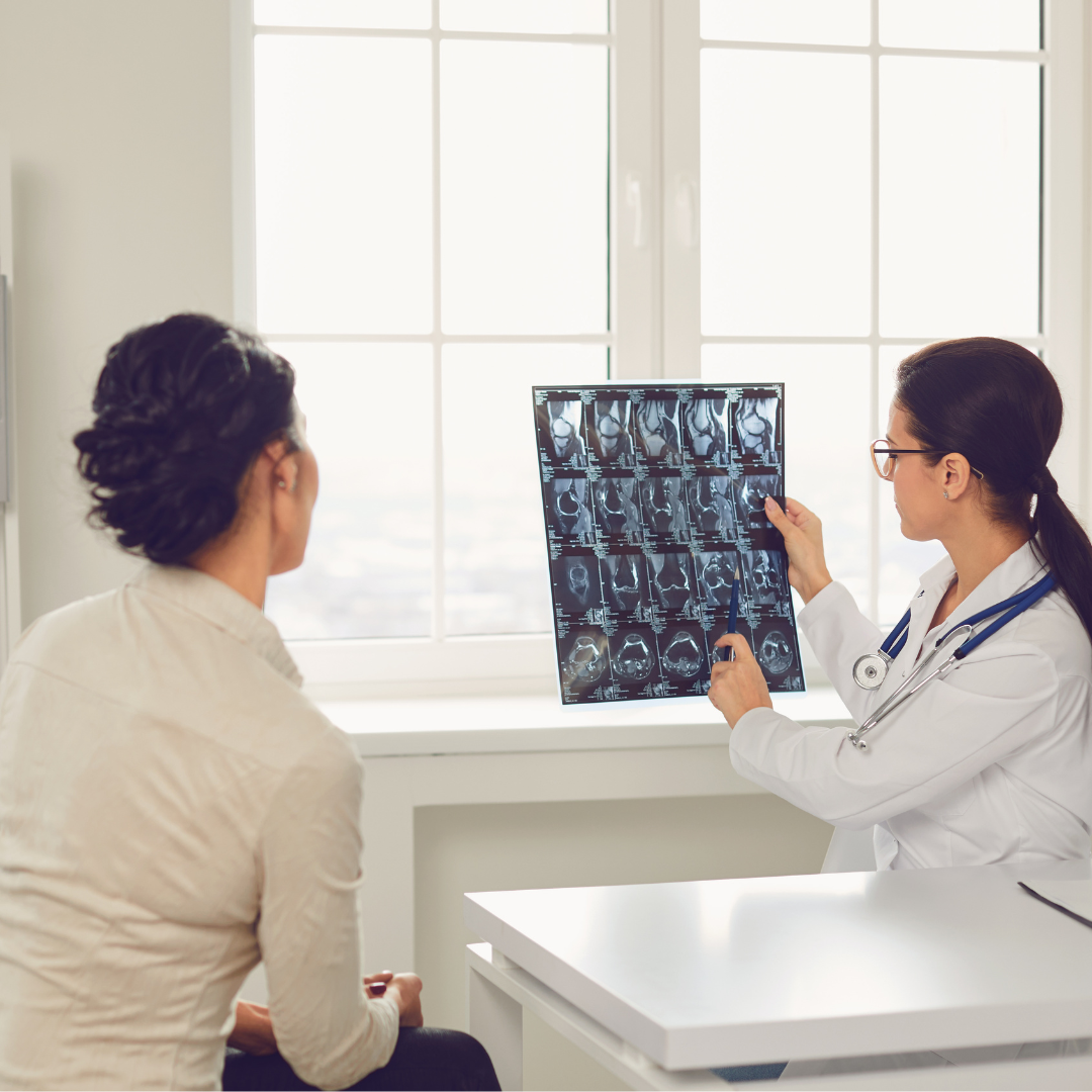 Dentist showing a patient dental X-rays during a consultation for professional teeth whitening treatment