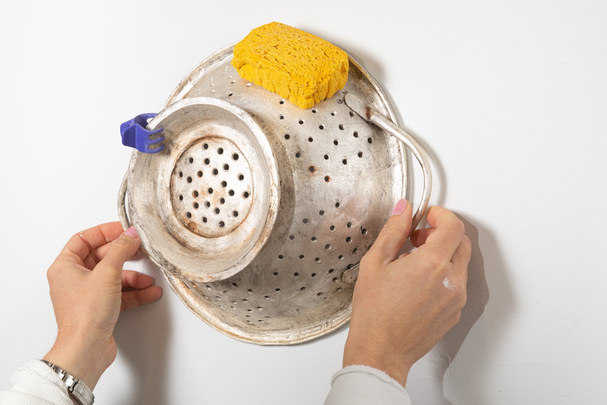 Colander with Sponge and Clip, 2021. Hydrocal, fiberglass, pigmented resin, sterling silver-leaf