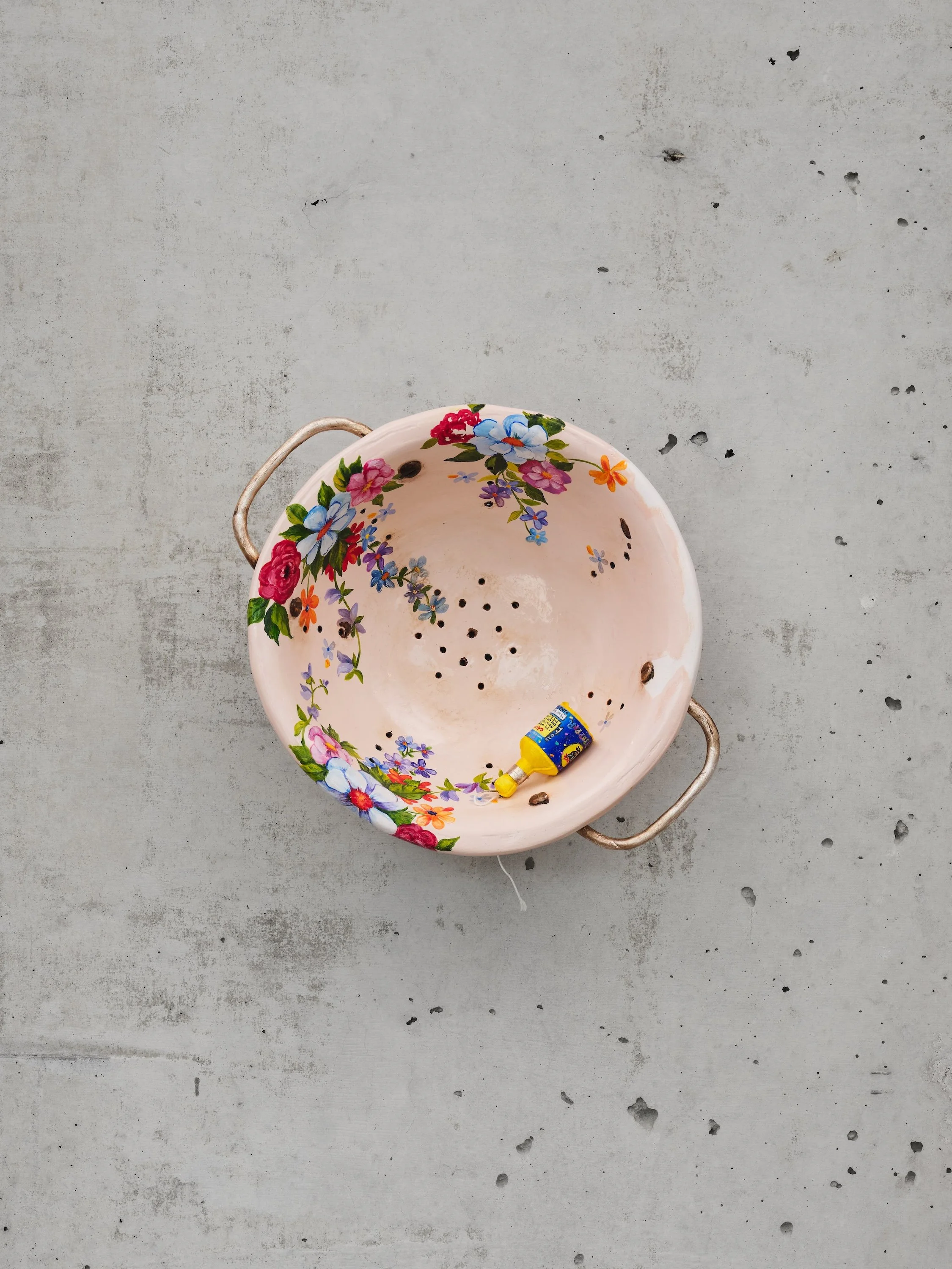 Colander with Party Popper, 2023. Hydrocal, fiberglass, enamel, copper, oil-based paint, cotton