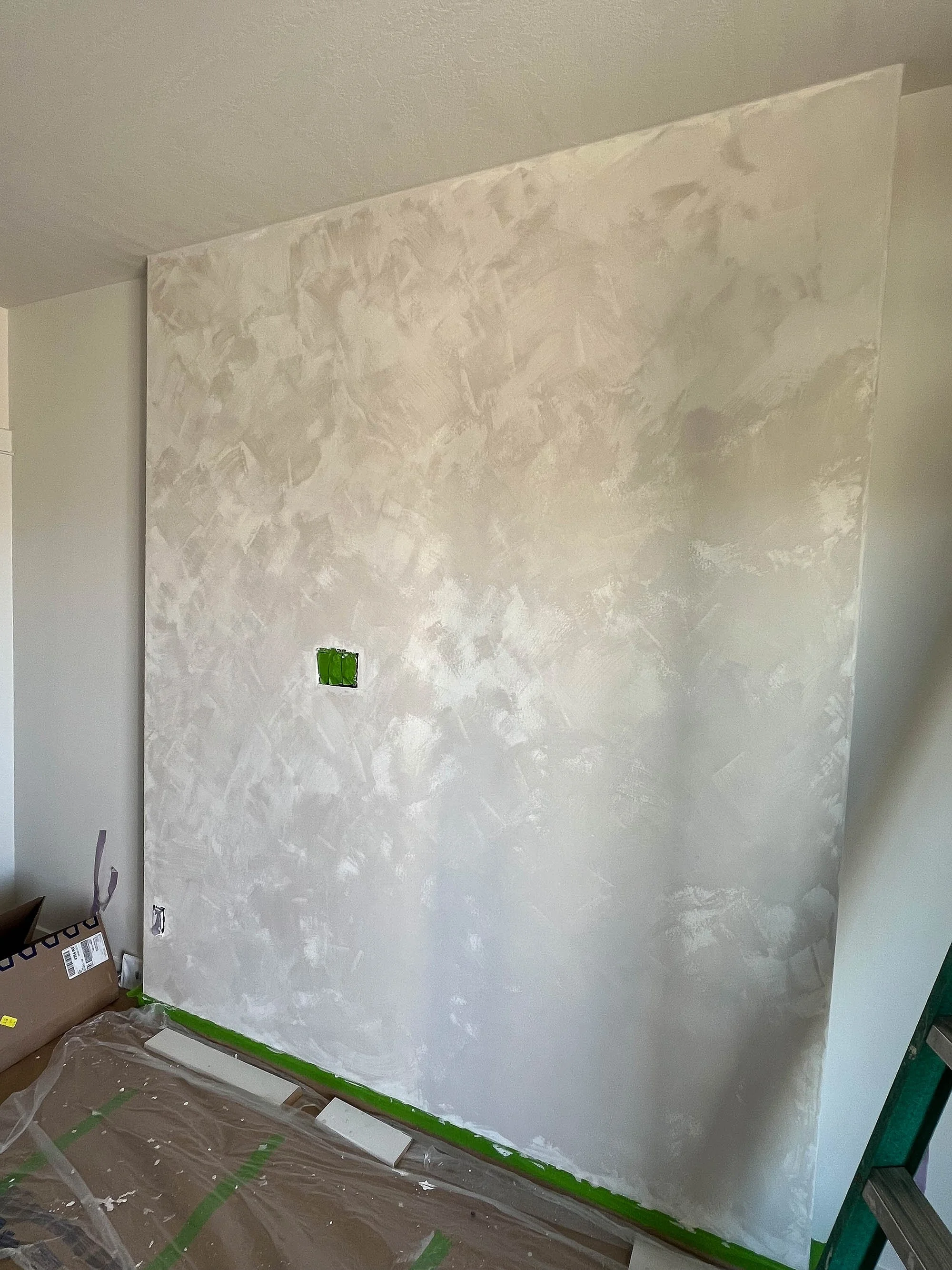 “Studio accent wall in Colour Atelier Bone 150% Darker lime paint – Limewashed by Ob” - This shade brings richness and subtle texture, perfect for creating an inviting atmosphere.