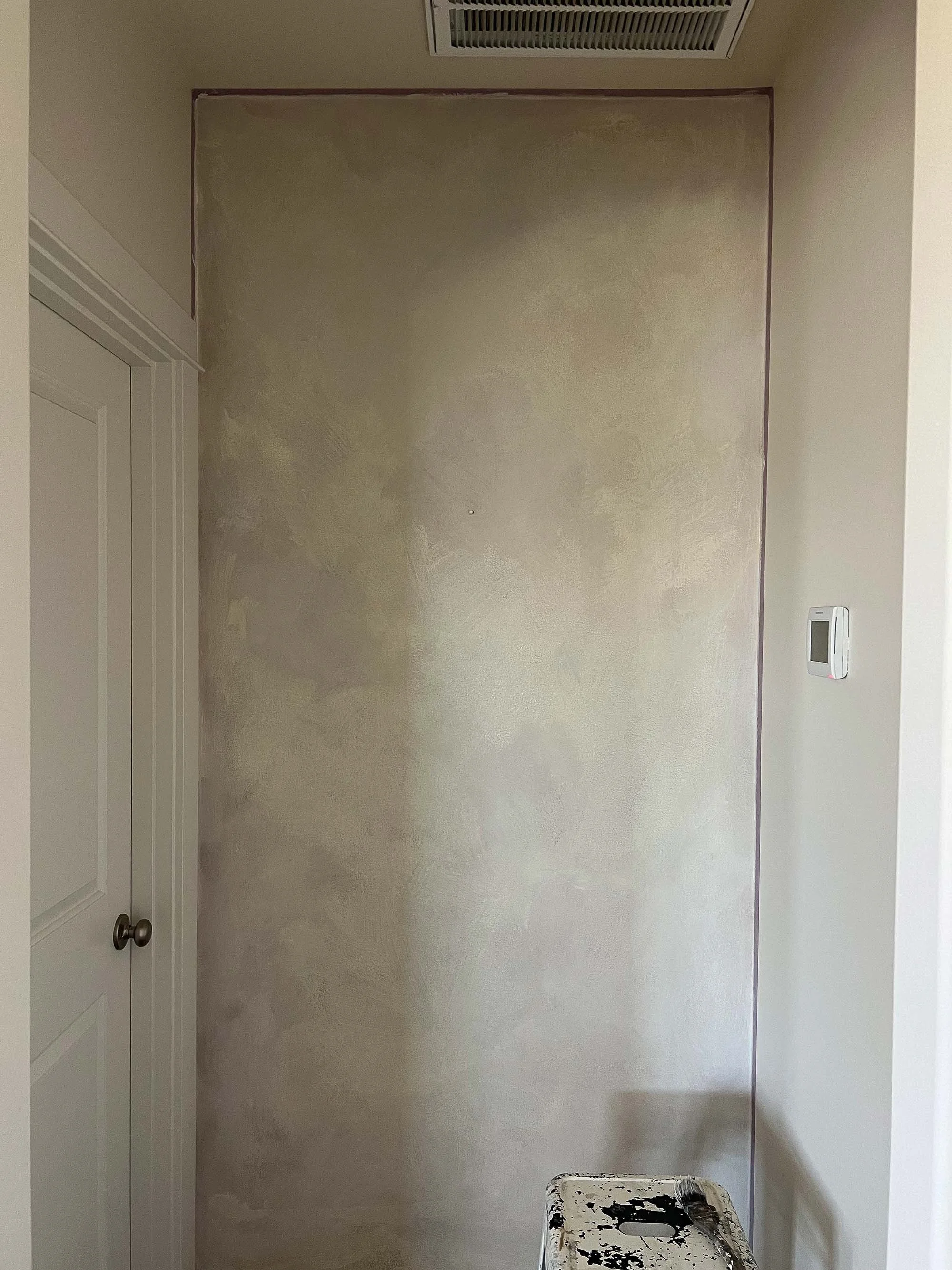 “Layered Colour Atelier Wabi and Bone tones bring natural depth and softness to this hallway limewash finish.”