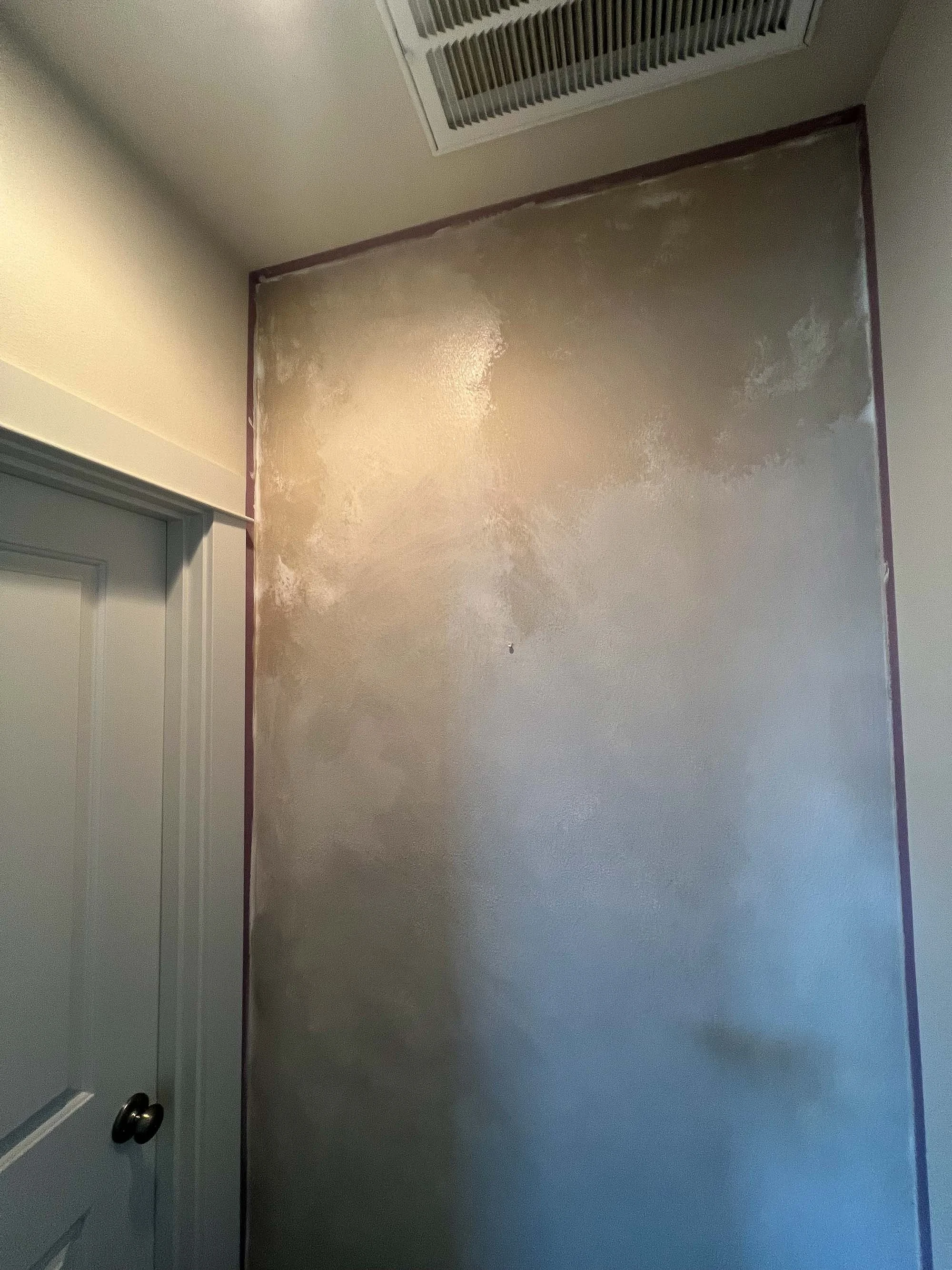 “Lait and Bone Colour Atelier lime paints layered to create a sophisticated hallway wall finish.”