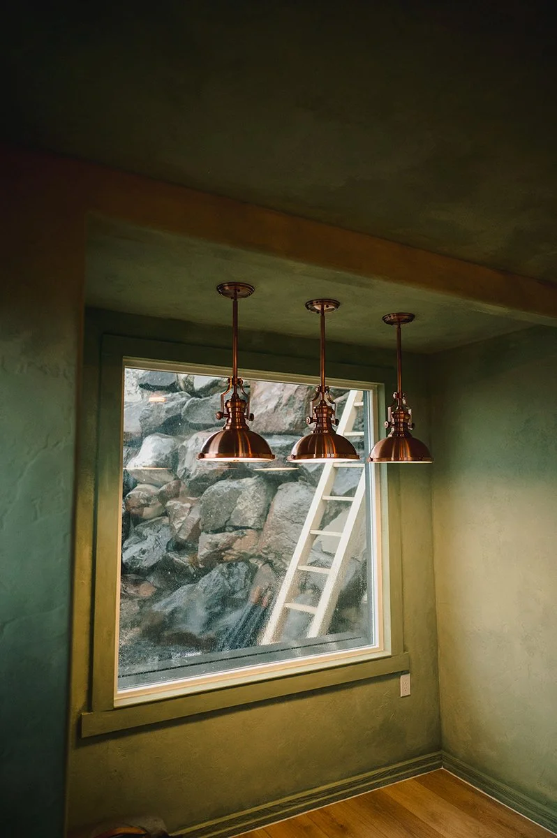 Natural daylight highlighting texture and contrast on limewashed garden shed walls.