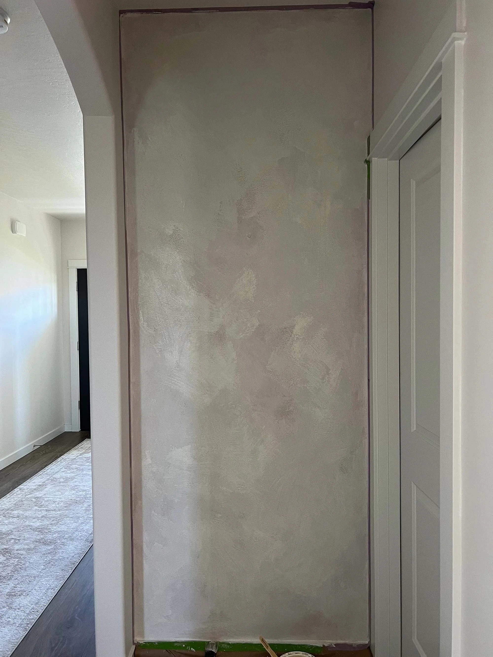 “Modern hallway limewash finish in Wabi and Chèvre tones by Limewashed by Ob, calm and elegant design.”