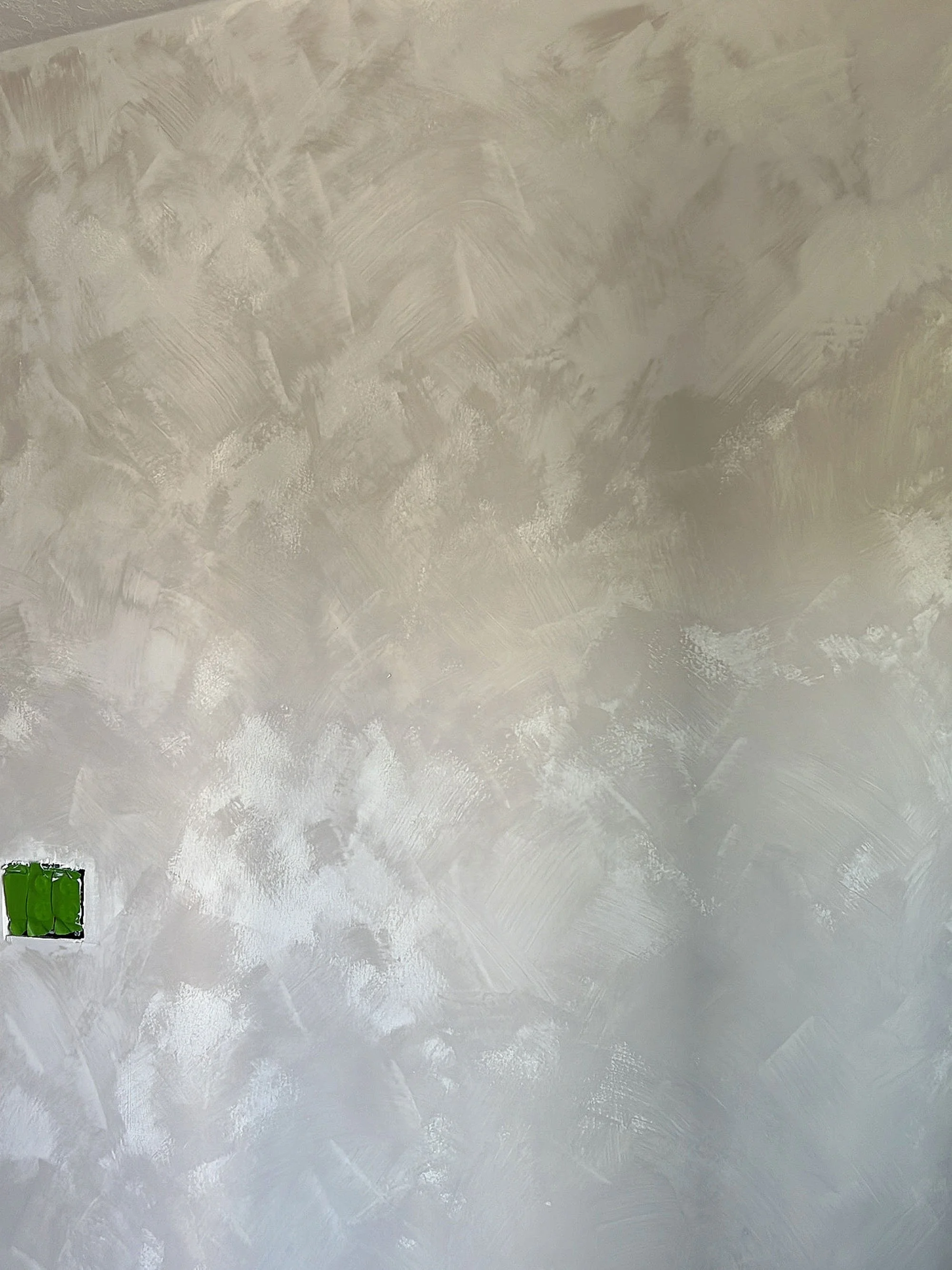 Accent wall with Colour Atelier Wabi 150% Darker lime paint, artisan limewash finish. - The deeper tone of Wabi highlights the movement and patina of true limewash. Its earthy depth gives the wall a sense of timeless sophistication.