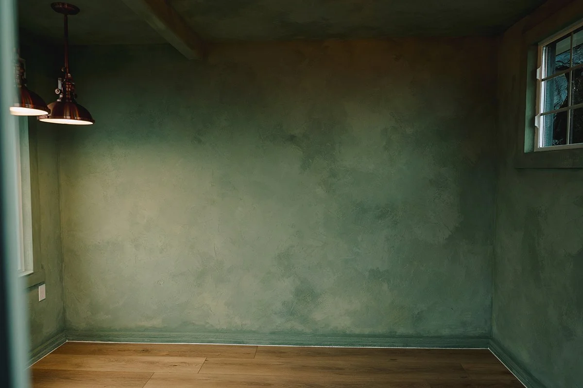 Entire room finished with layered Color Atelier Cypress Ink limewash tones, creating soft depth, natural movement, and a calm, cohesive atmosphere throughout the space.