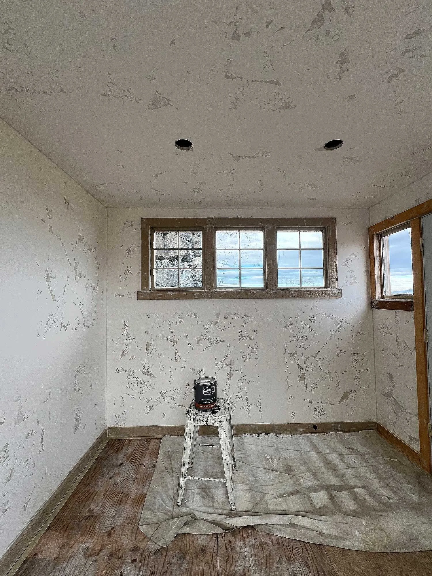 Venetian textured drywall finished with limewash inside a garden shed.