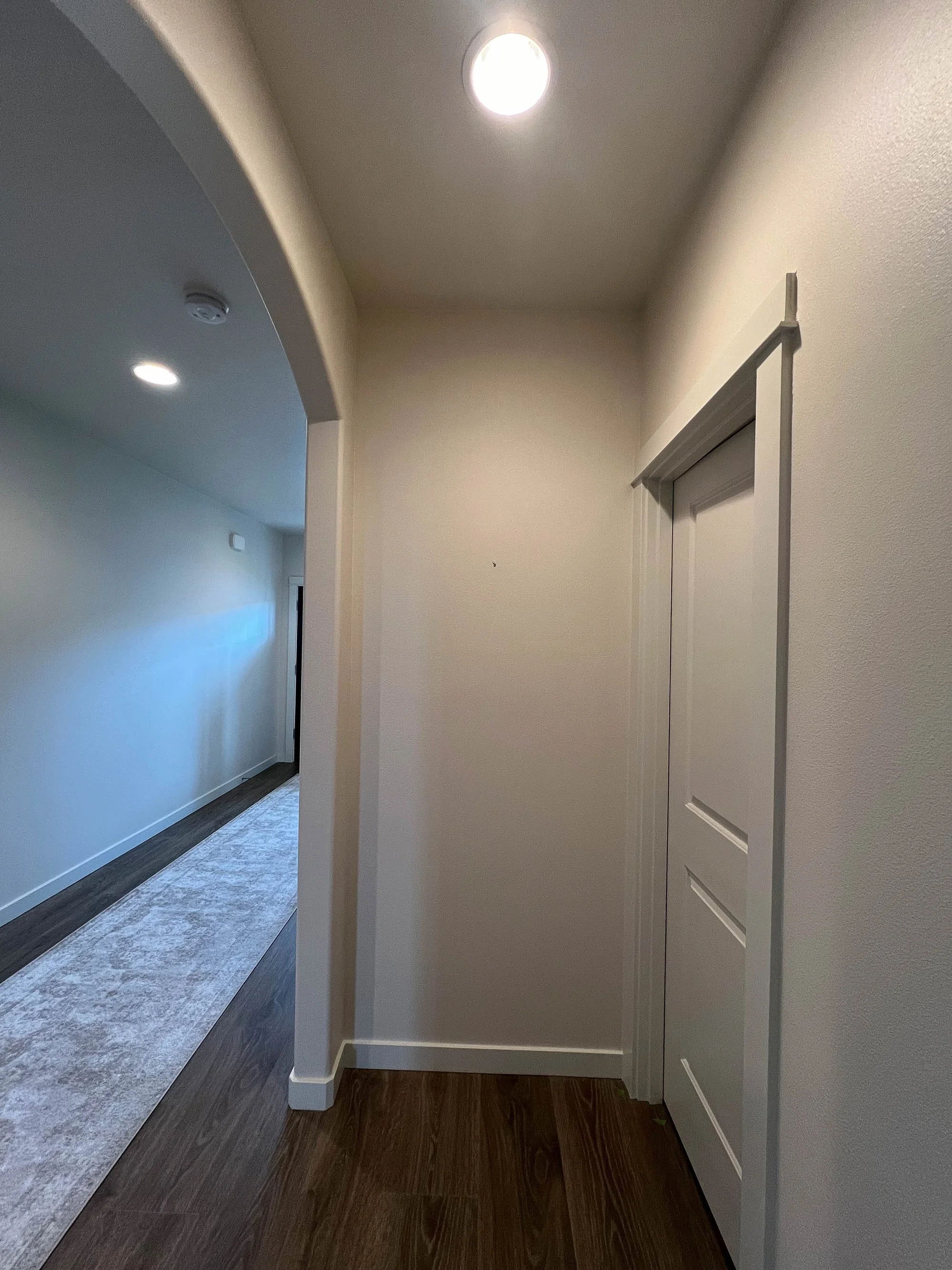 Before and after hallway limewash transformation showing depth and organic surface variation.