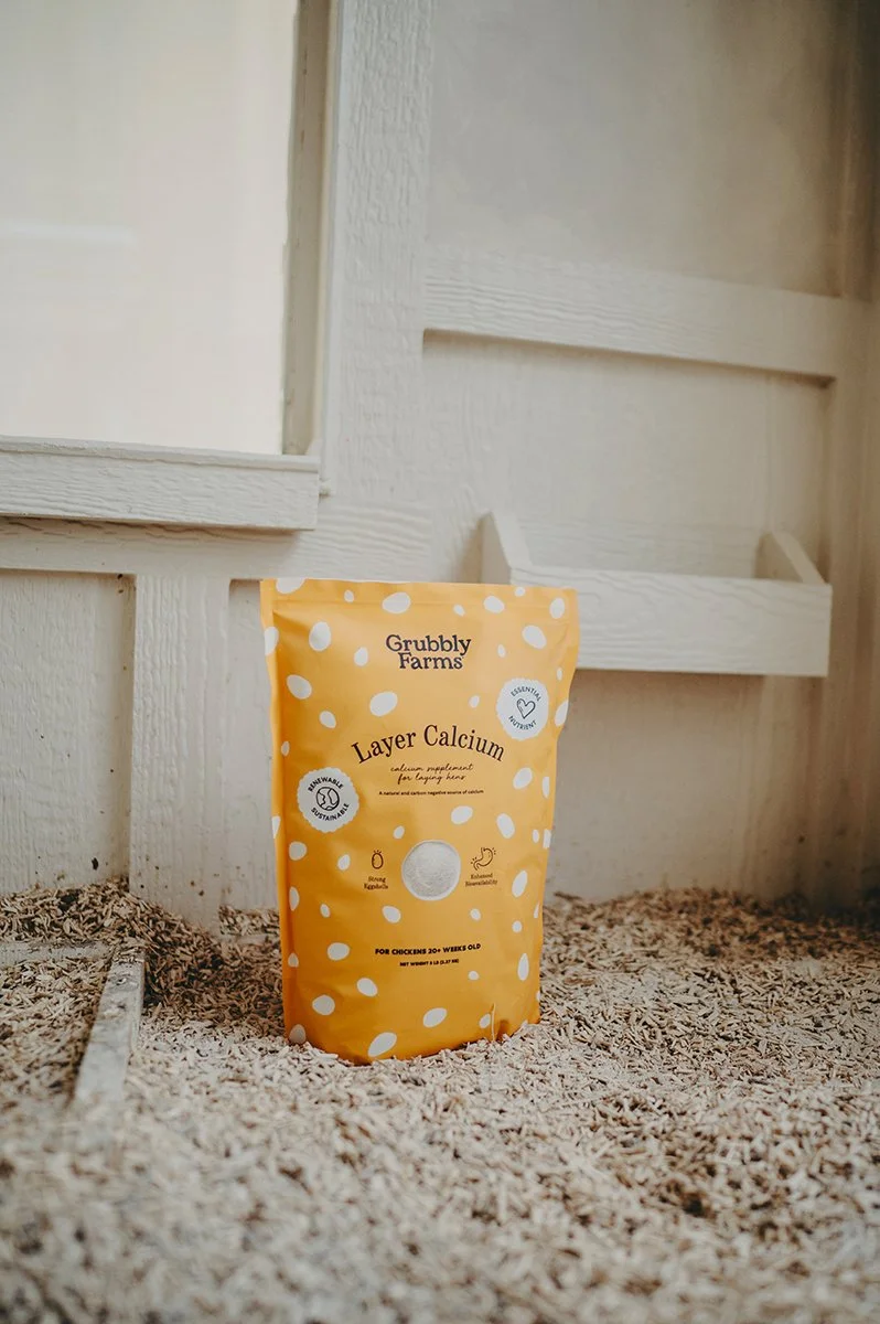 chateau-de-luvi-grubbly-farms-layer-calcium-bag-next-to-feeder.jpg