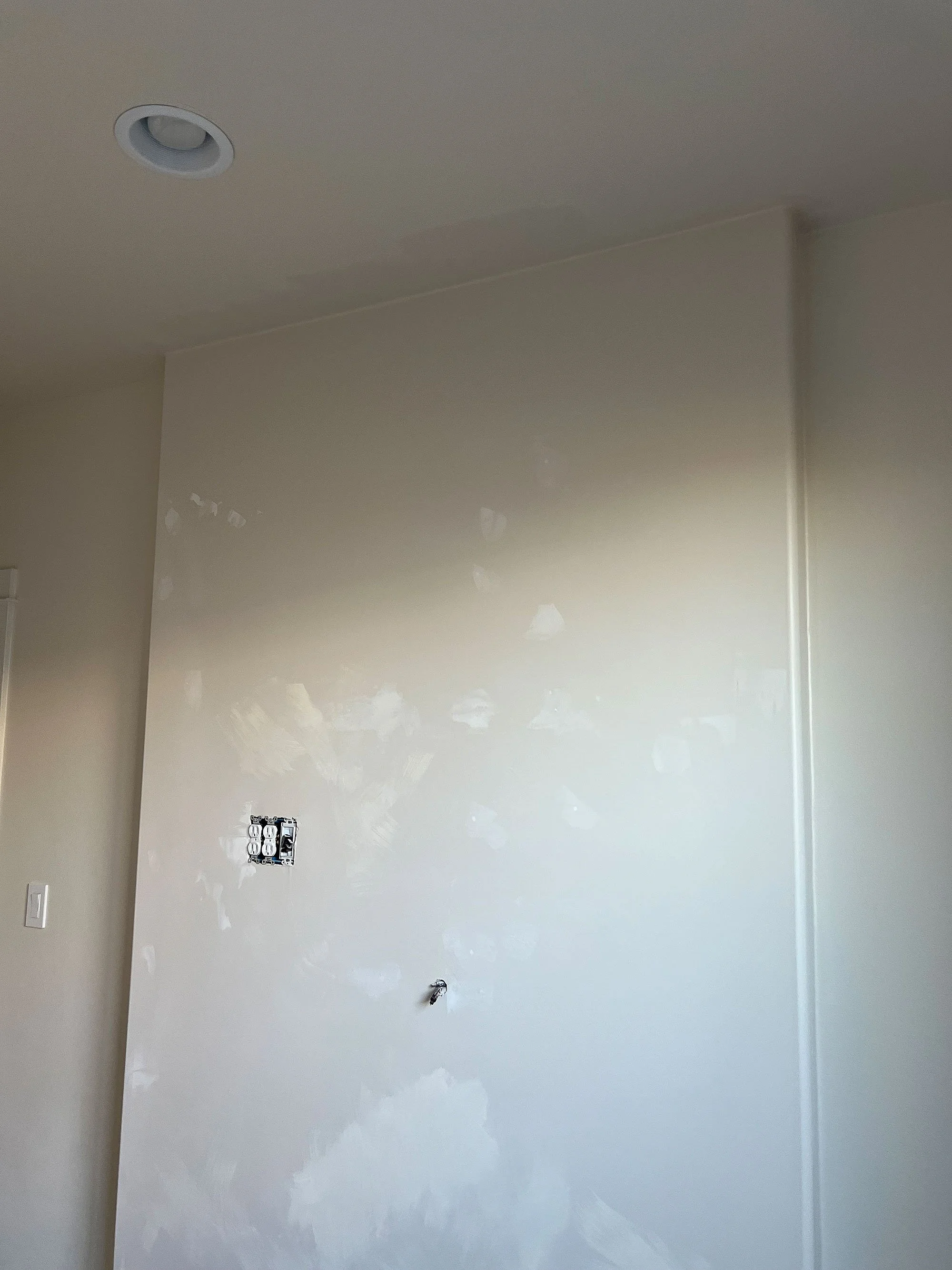 "Layered limewash accent wall finish in bedroom with Bone and Wabi Colour Atelier  lime paints - The interplay of light and dark creates a wall that feels alive, organic, and uniquely crafted.