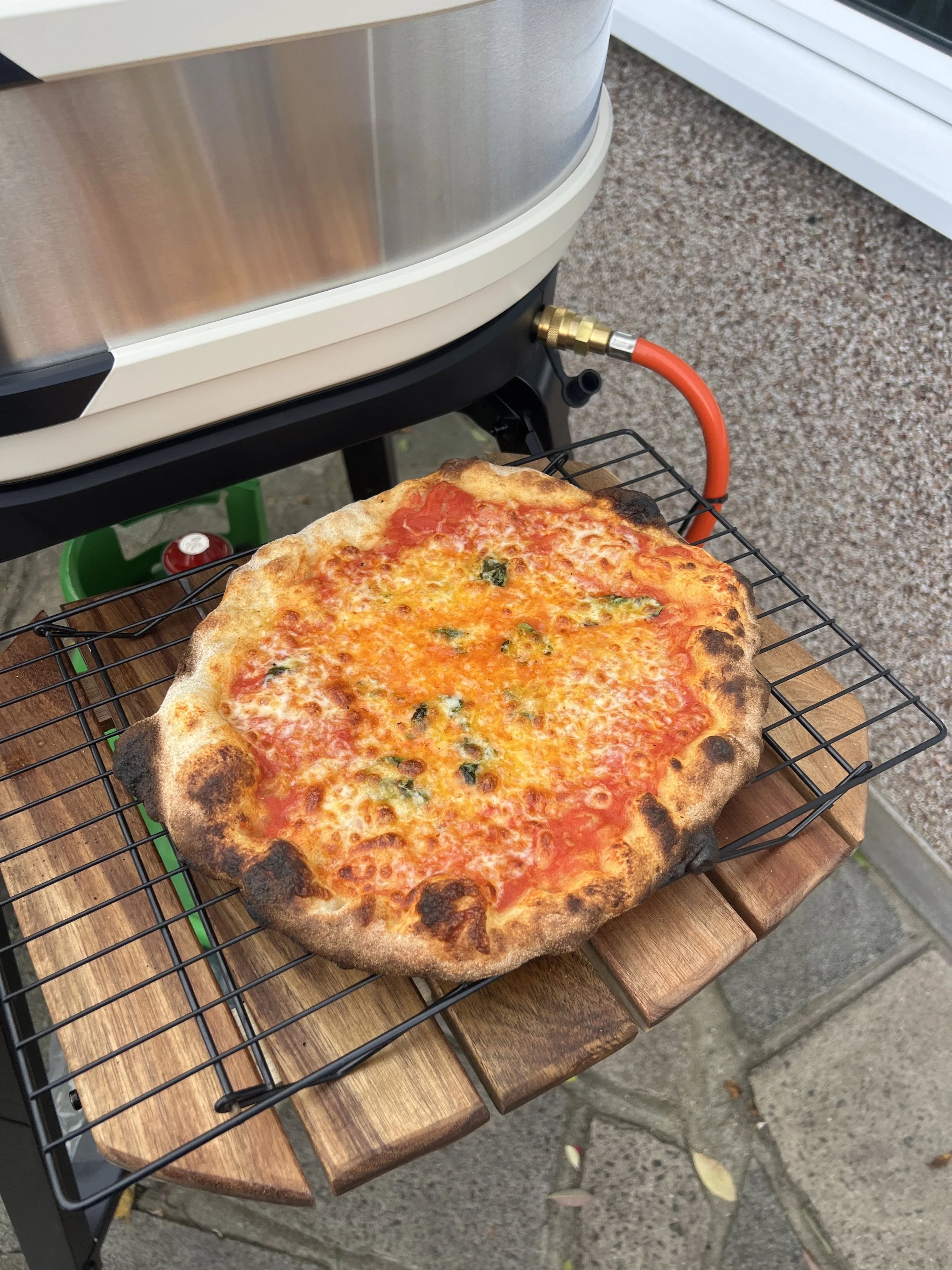 cheese pizza next to oven
