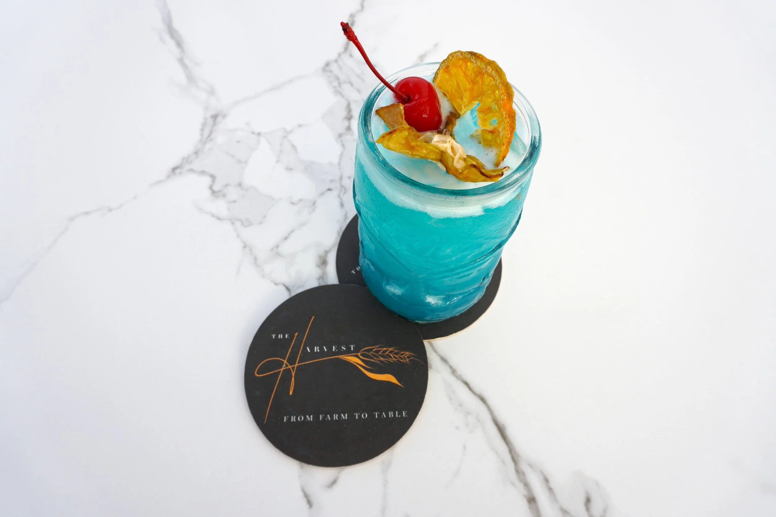 Tropical Ocean Cocktail - Blue Curacao, Cherry and Dried Fruit Garnish