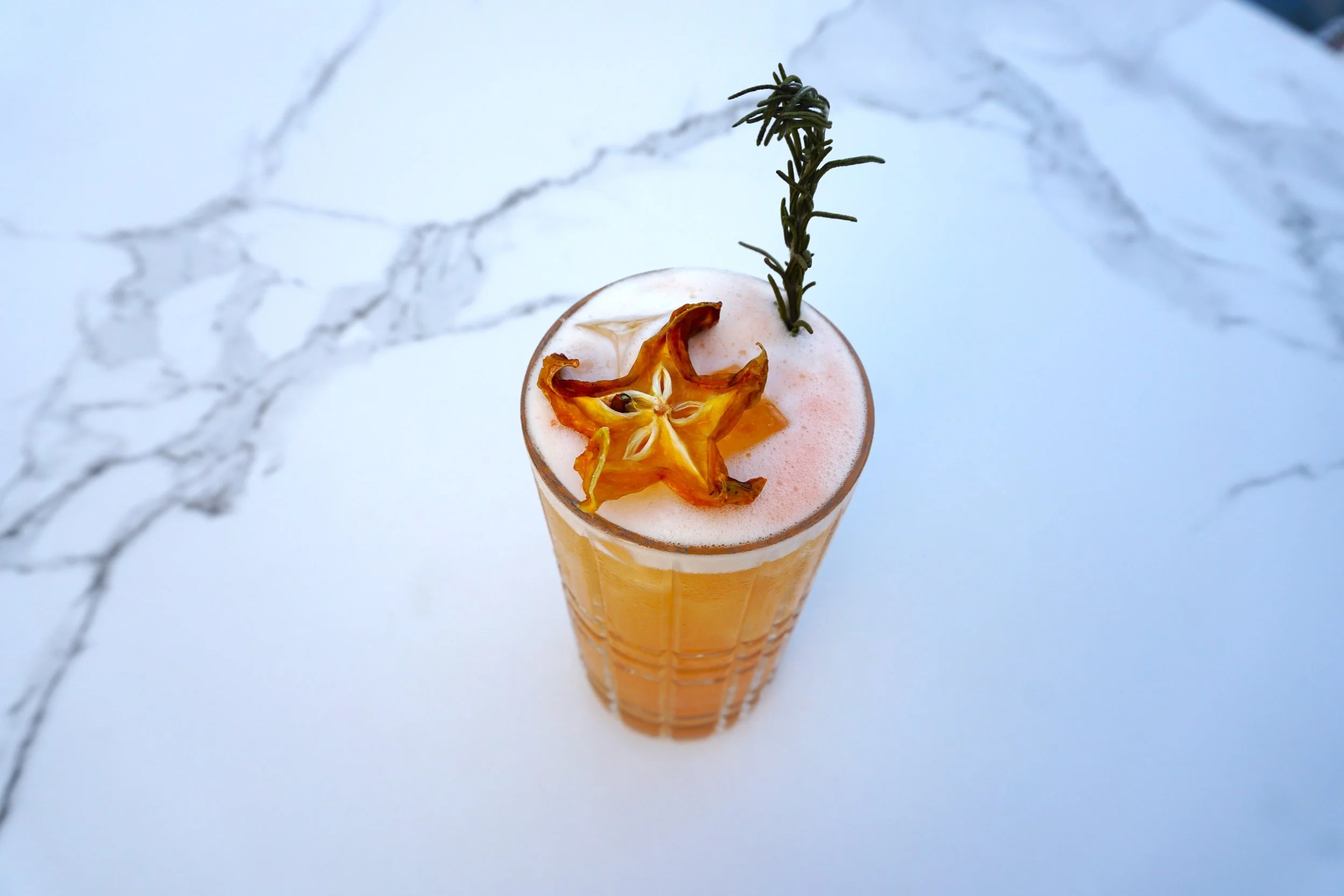 Island Summer Cocktail - Dried Starfruit and Rosemary Garnish