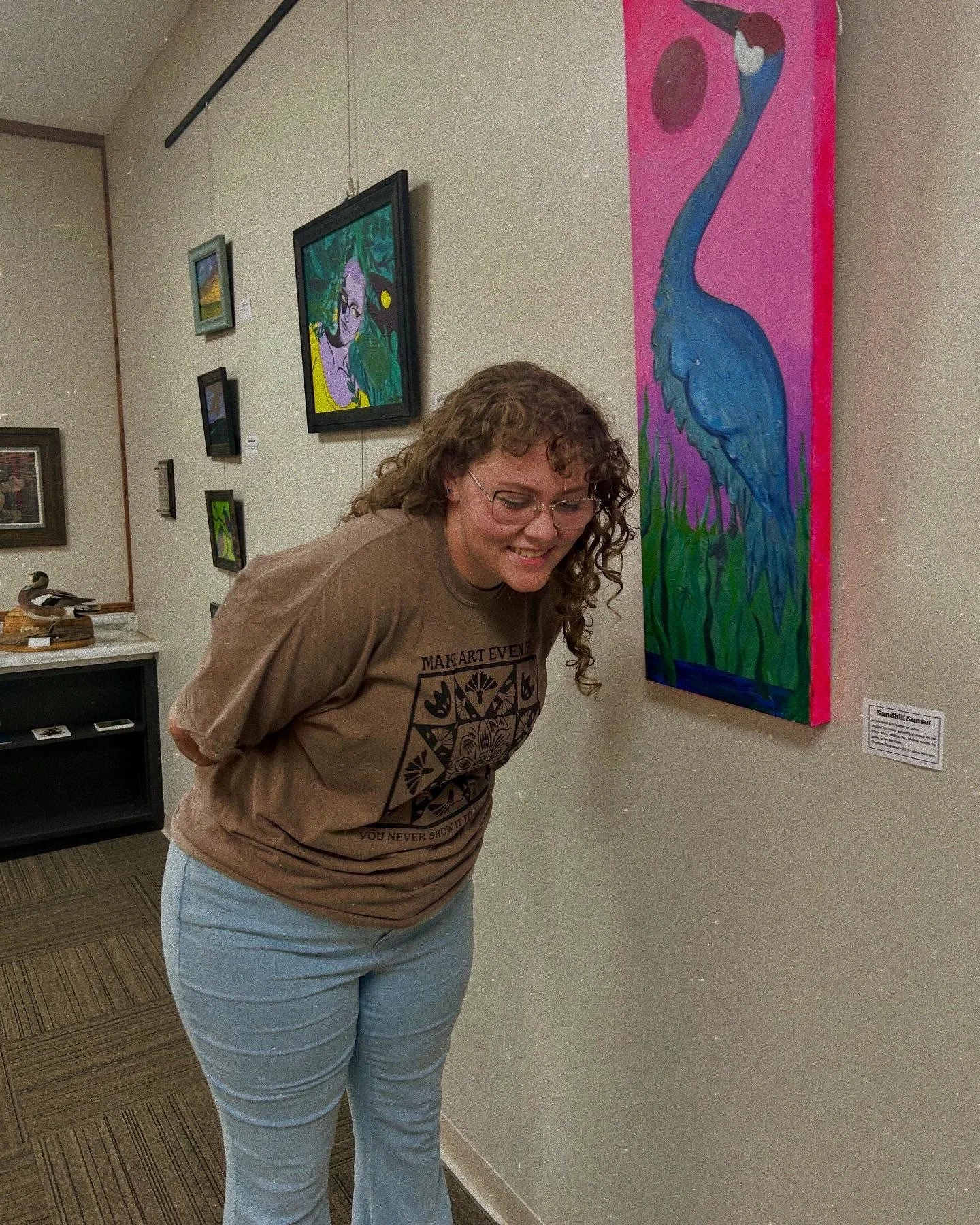 Artist Cheyenne Riggleman with pieces from her Prairie Watchers show.