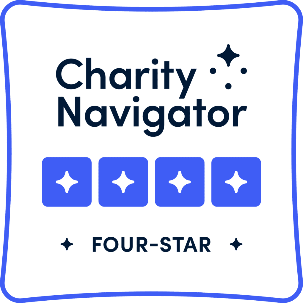 A badge or guide titled 'Charity Navigator' with four blue squares, each containing a white star, and the text 'Four-Star' below.