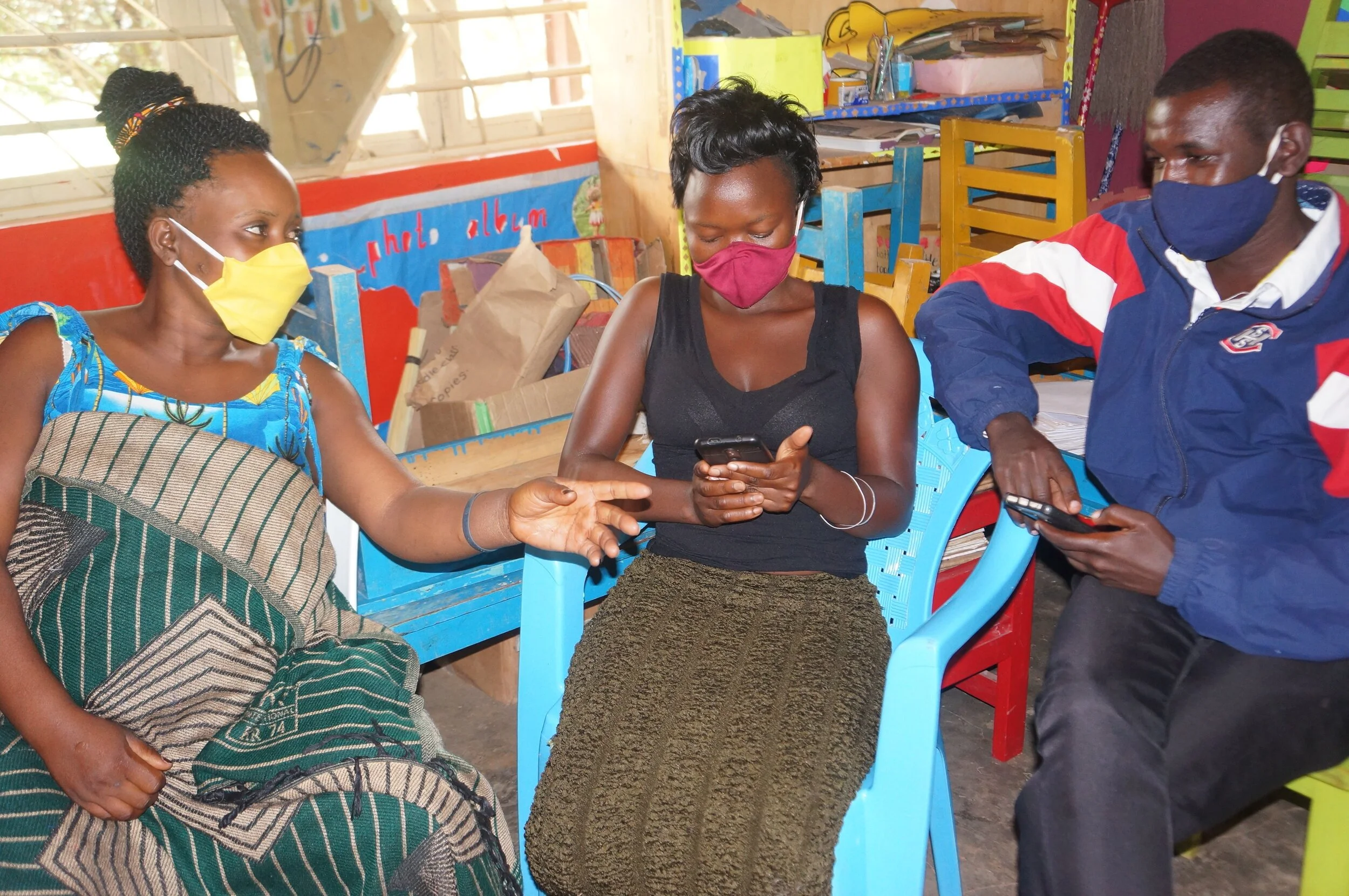 Parents learning how to use Google Classroom on their smart device