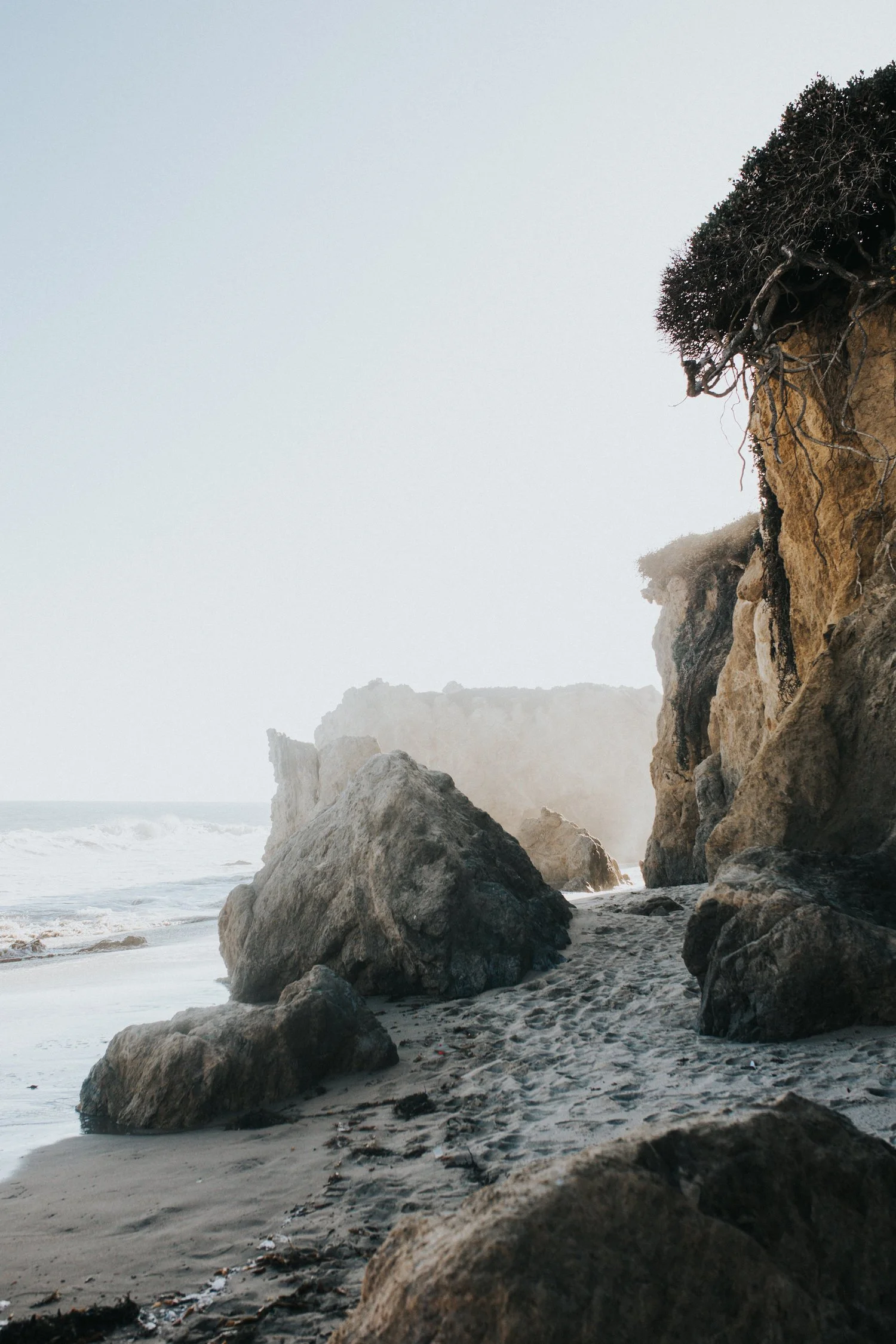Rocky Pacific coastline at El Matador Beach, Malibu, California at golden hour — travel photographer Anna Hudson