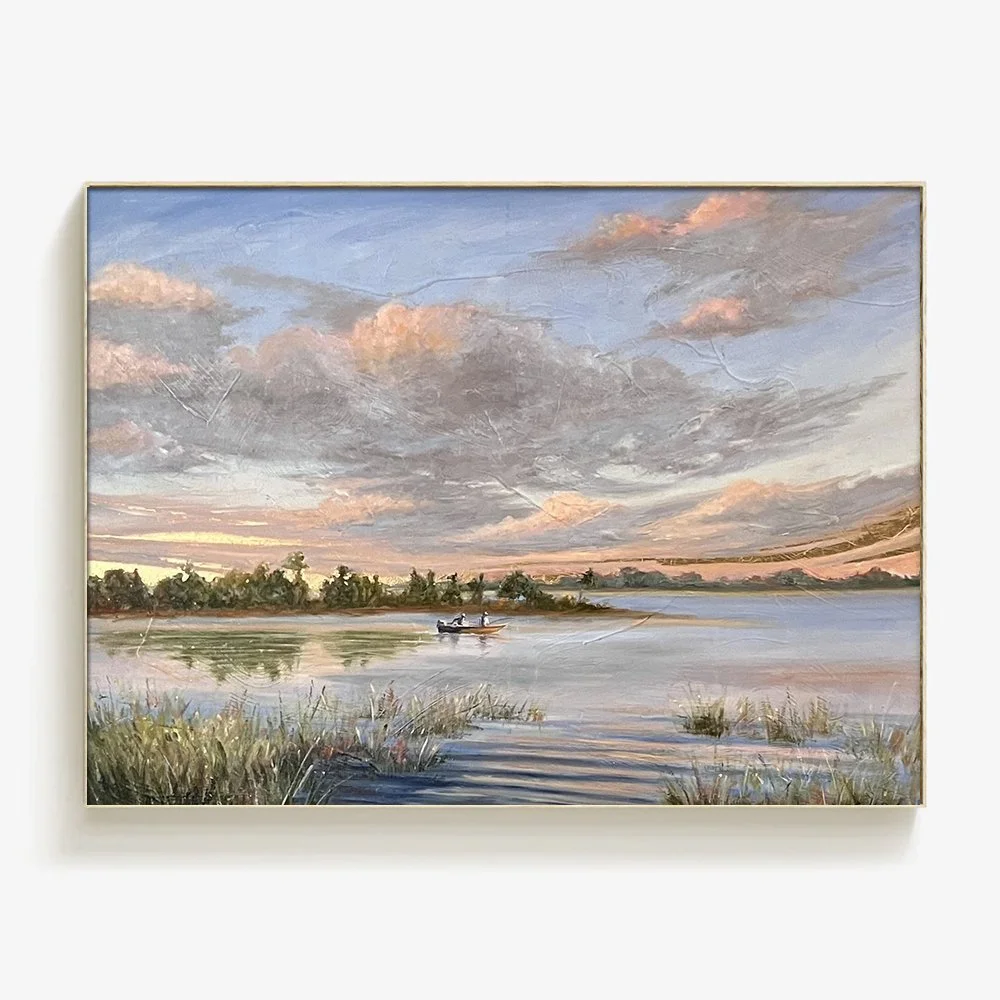 A landscape painting of a lake at sunset with a boat and two people on it, surrounded by grass and trees, with clouds in the sky.