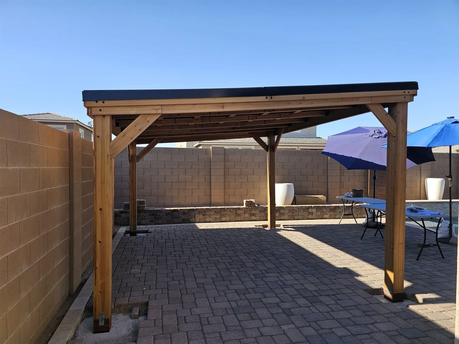 Hot take: Phoenix summers are better in the shade: cedar pavilion on pavers
