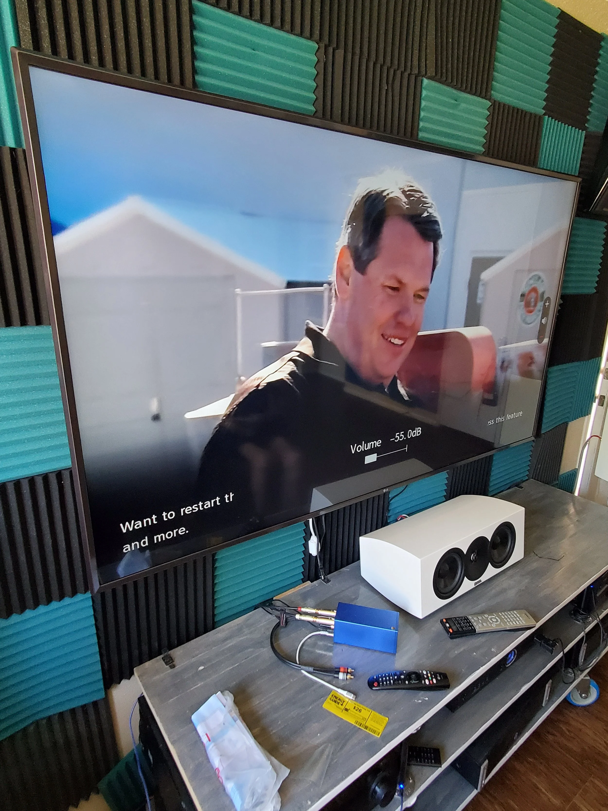 Professional TV wall mounting on a custom feature wall in Phoenix, AZ, featuring precision stud-finding behind decorative wall paneling, specialty wall anchors, and concealed in-wall wire routing.