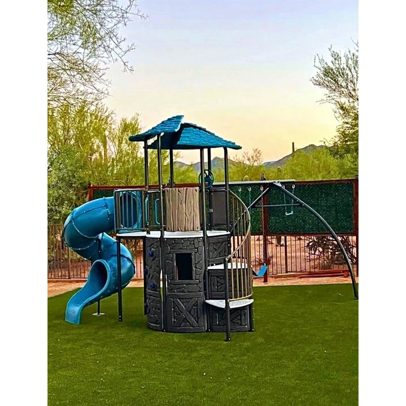 Lifetime Adventure Castle swing set with spiral slide assembled in a Cave Creek backyard