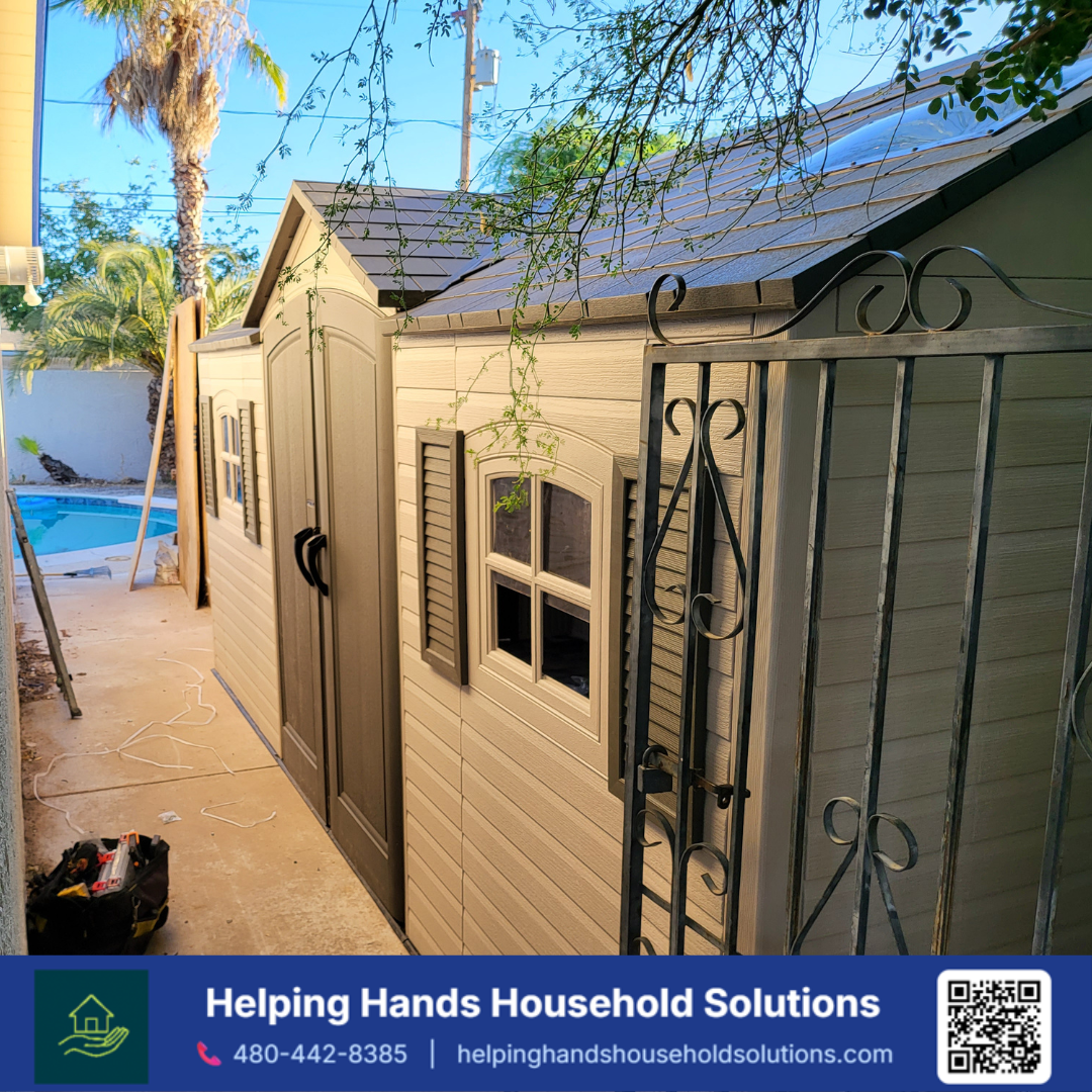 Lifetime  storage shed with double front doors, side entry doors and windows, installed poolside on a concrete patio in Phoenix, AZ by Helping Hands Household Solutions — durable, weather-resistant panel construction built to withstand the Arizona su
