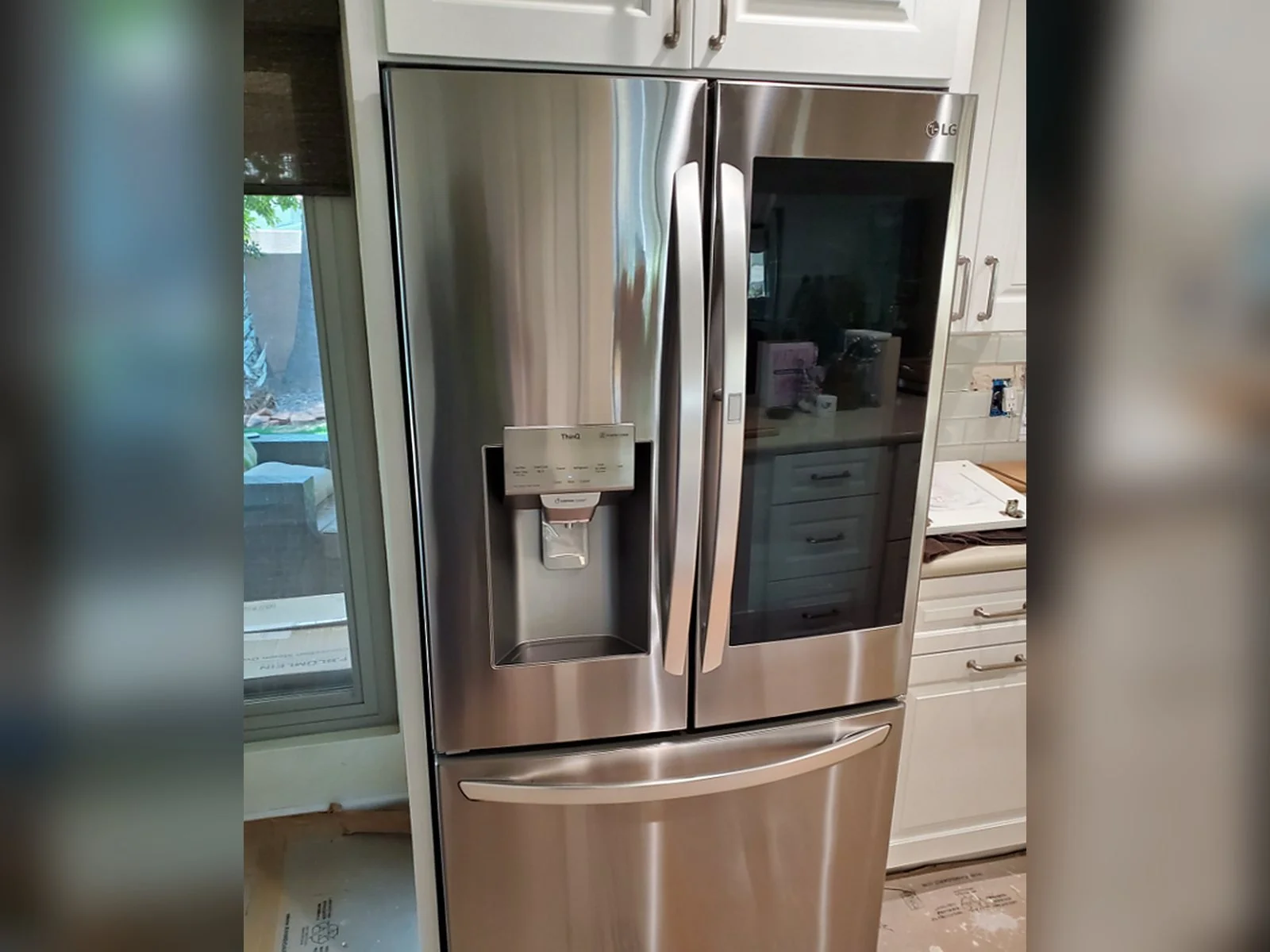 LG InstaView French door refrigerator installed by the Helping Hands appliance installation crew in a Phoenix kitchen