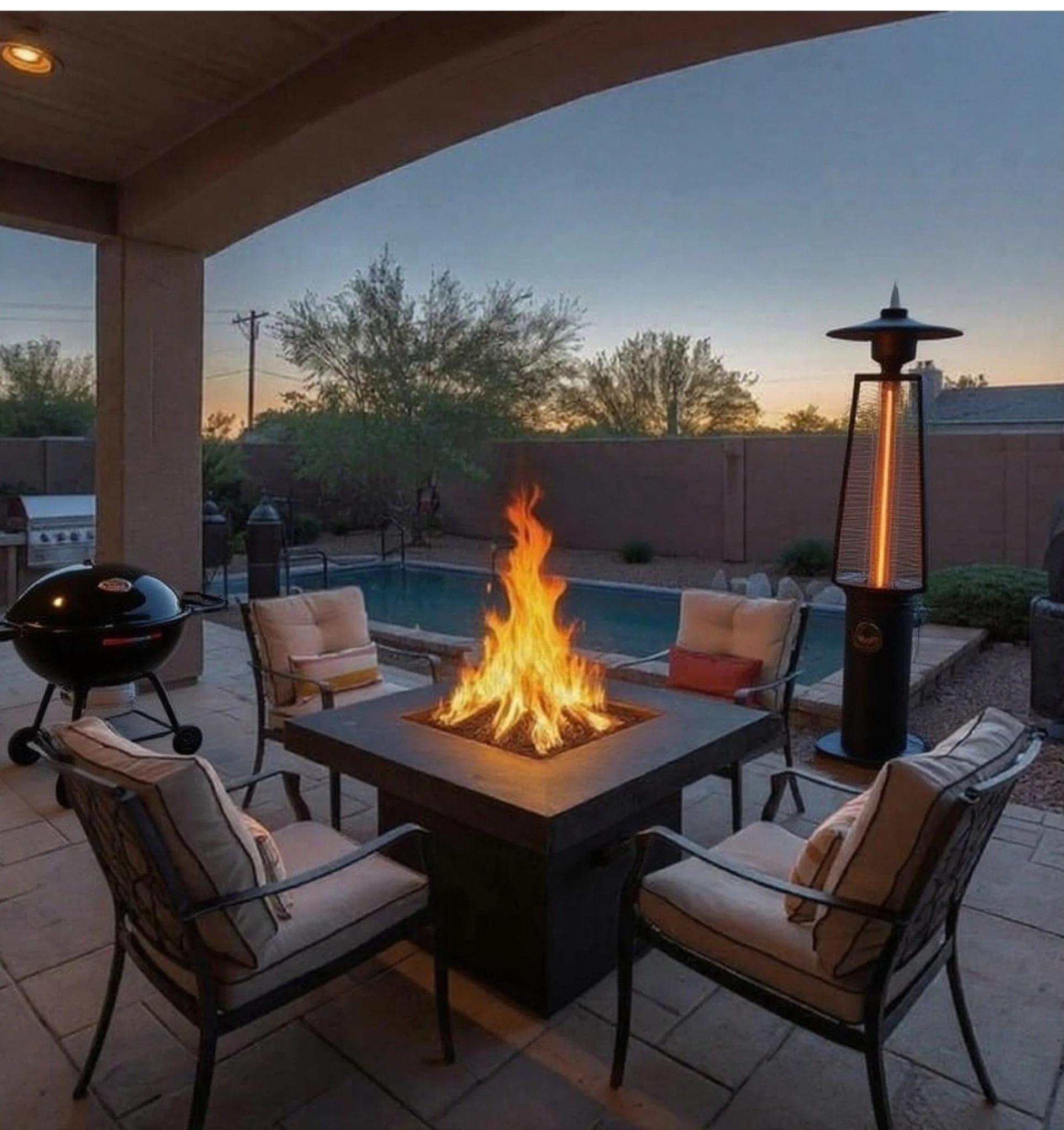 firepit table, outdoor heater, and bbq grill assembled on patio in Phoenix backyard.