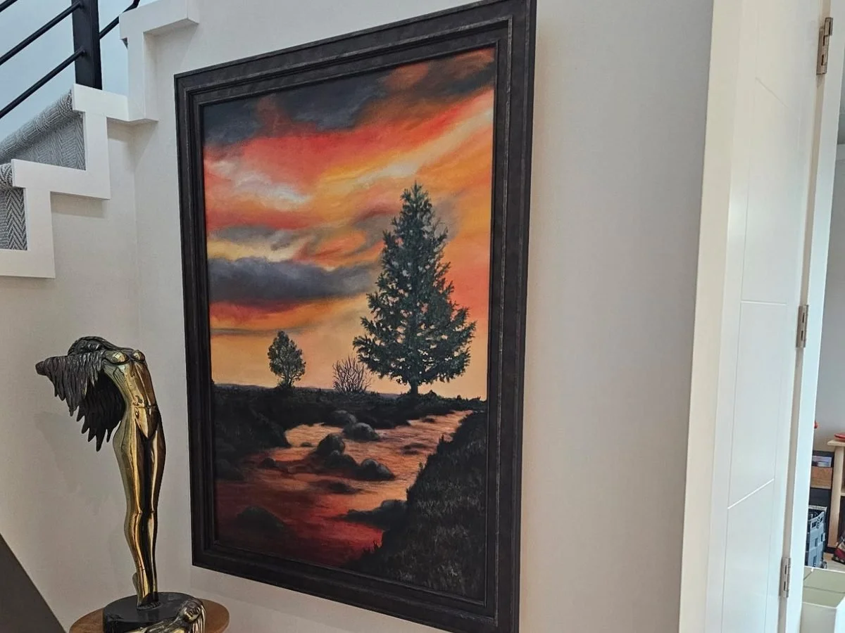 Framed painting hung in a Phoenix stairwell by Helping Hands