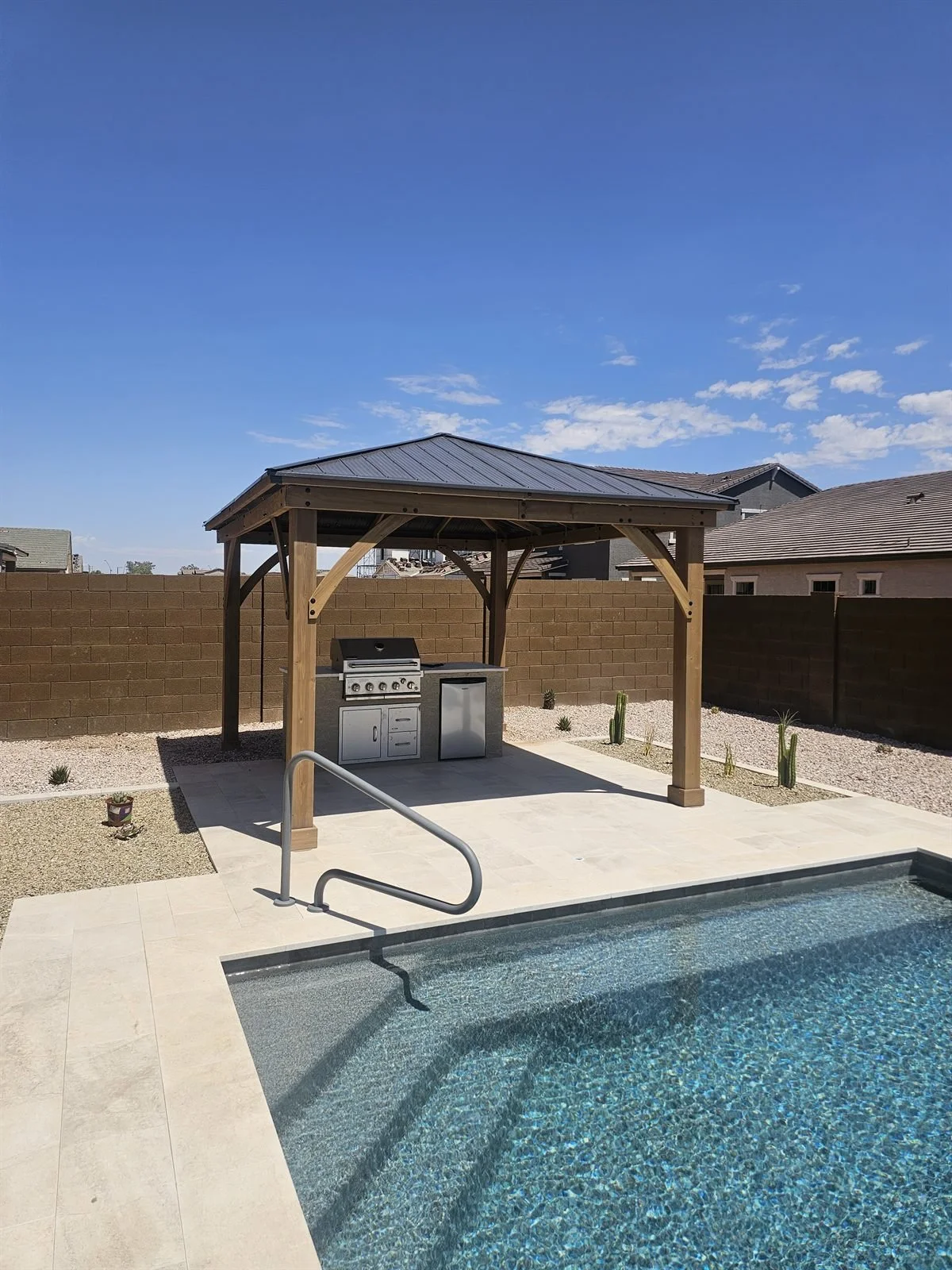 Outdoor kitchen, indoor comfort: wood gazebo over the grill island