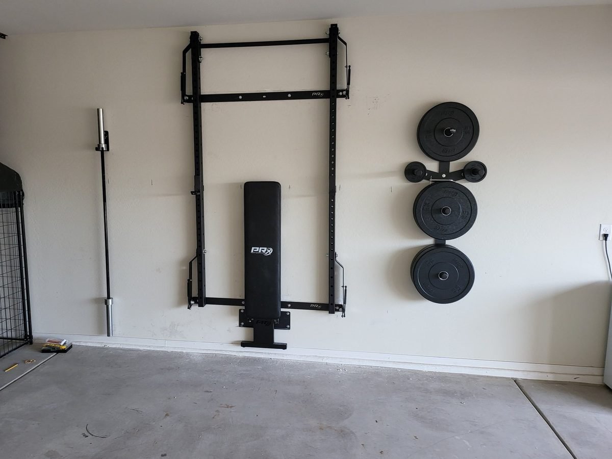 Wall mounted home gym rack and weight storage installed in Phoenix