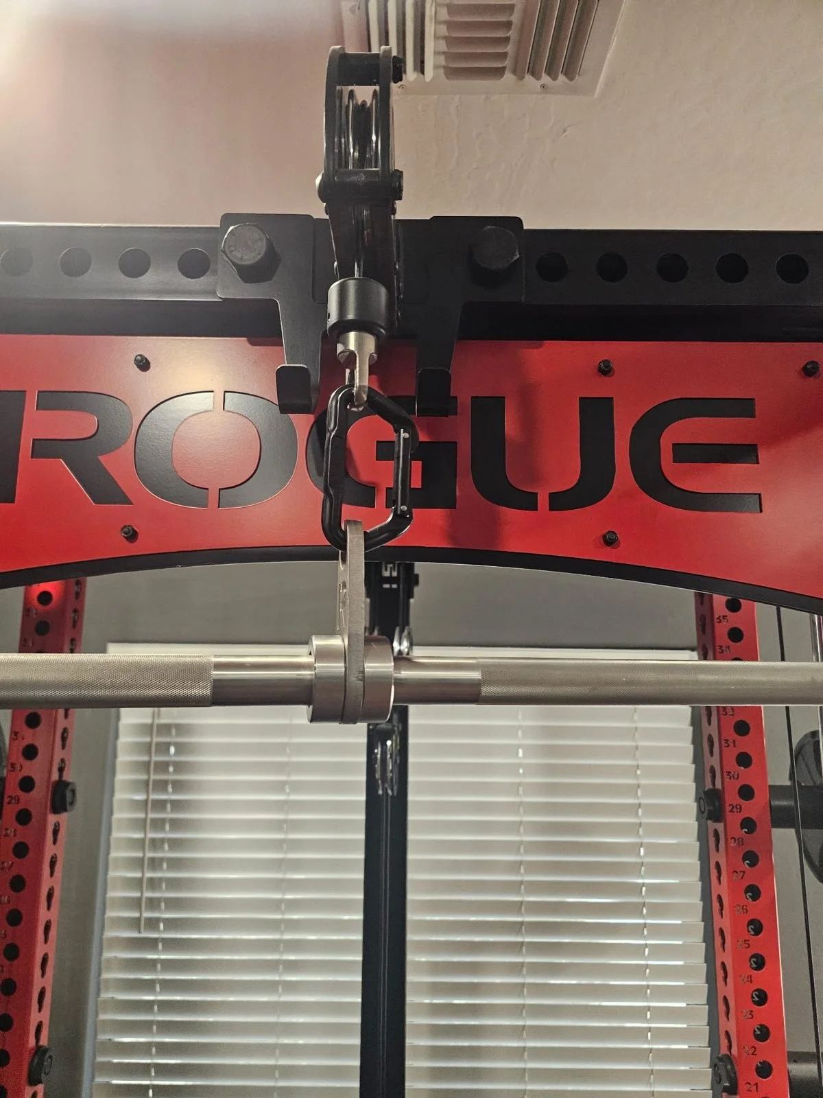 Rogue lat pulldown attachment installed on a home gym rack in Phoenix