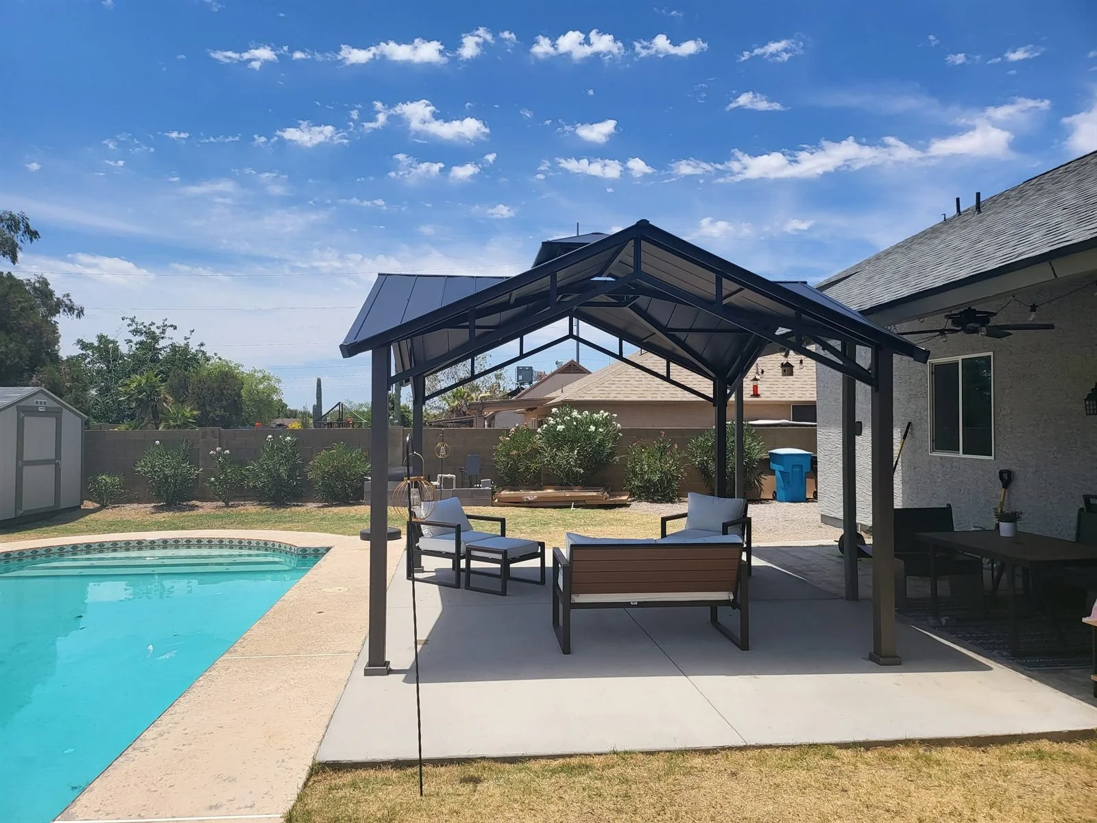 Pool day, minus the sunburn: metal-roof gazebo by the pool