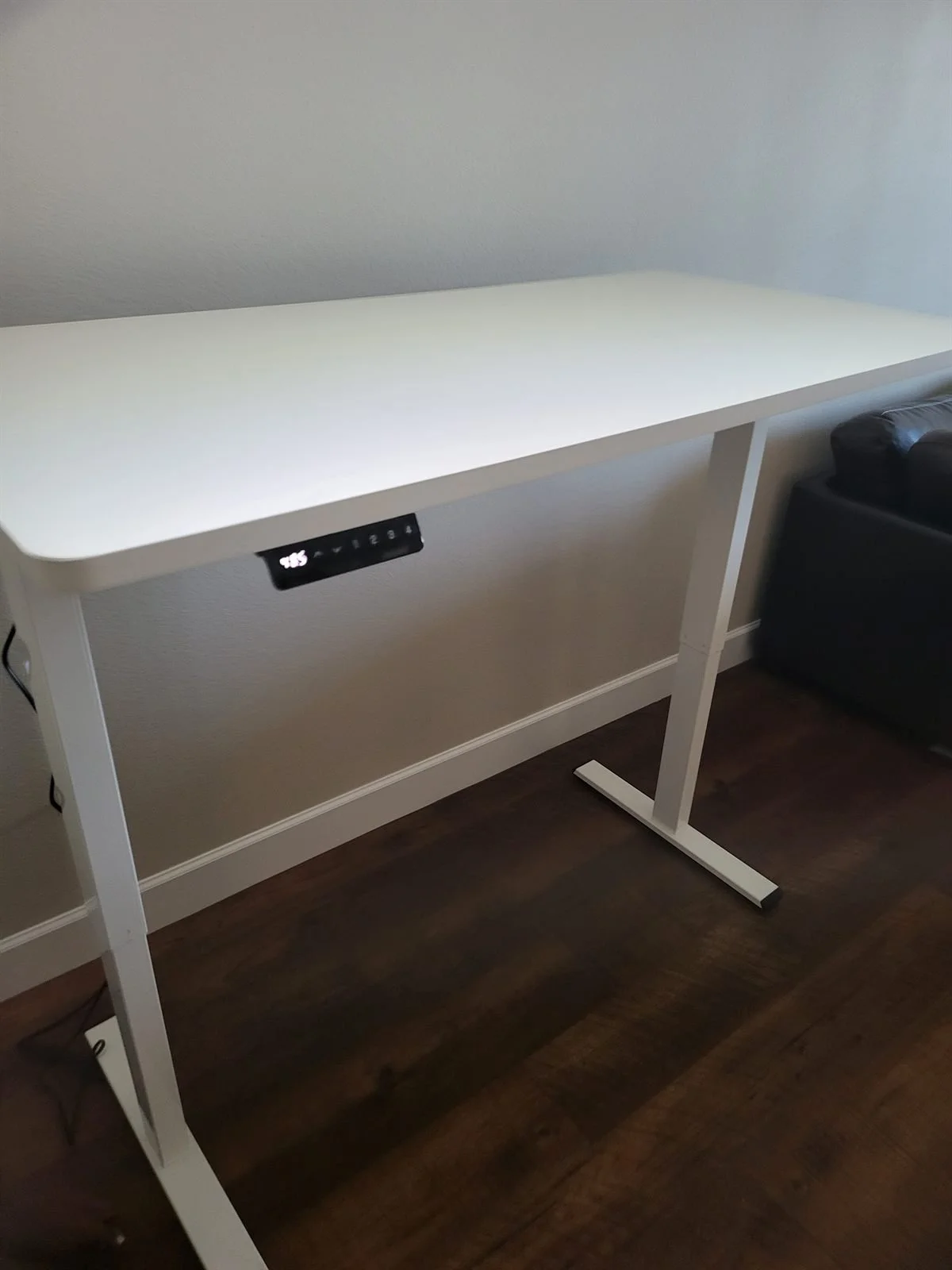 White electric standing desk assembled for a Phoenix home office