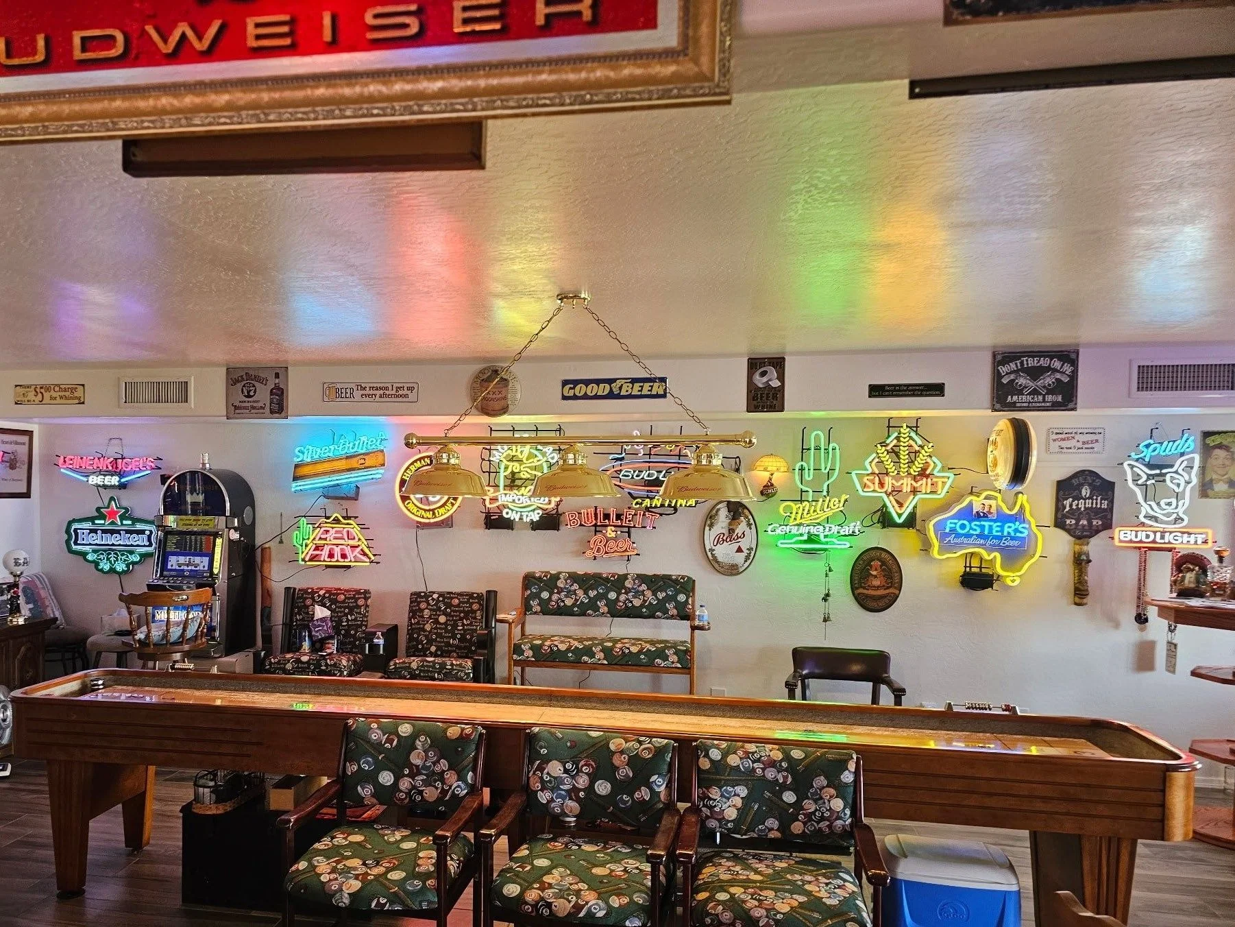 Finished game room with a shuffleboard table and neon signs hung, San Tan Valley, AZ