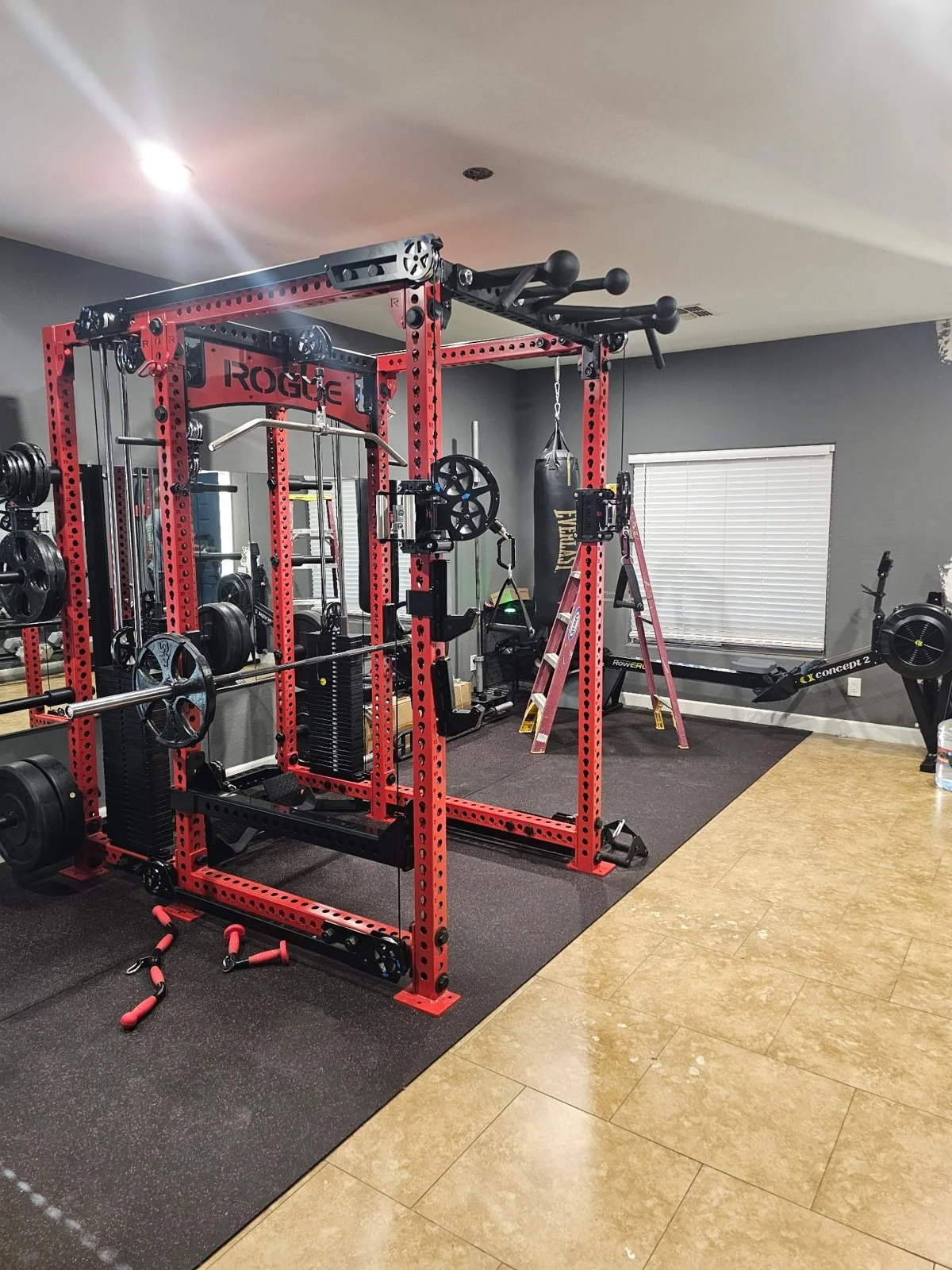 Rogue power rack and cable system assembled in a Phoenix home gym