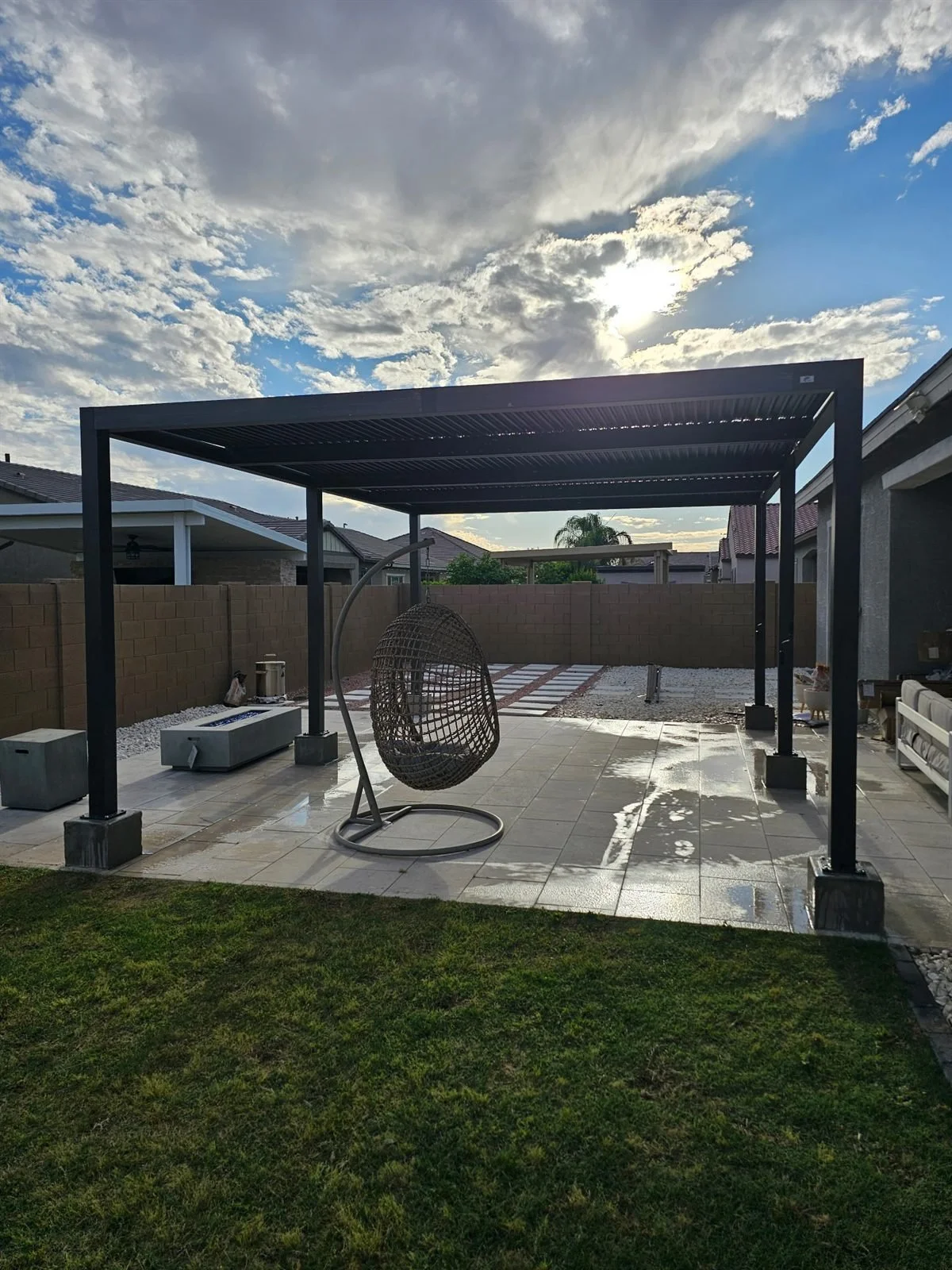 Monsoon-ready: louvered pergola anchored on concrete footings