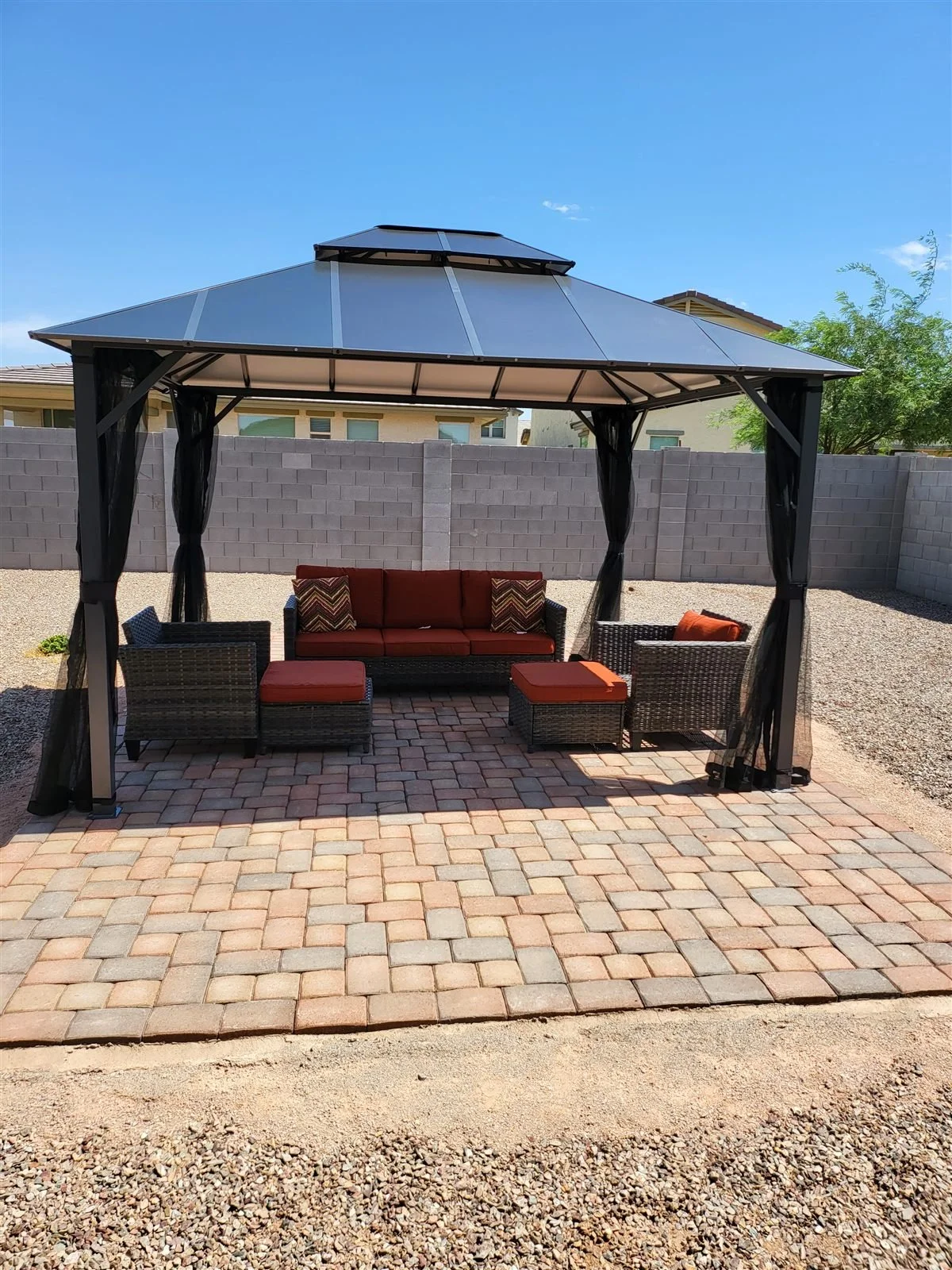 Bug-free lounging: hardtop gazebo with mosquito netting