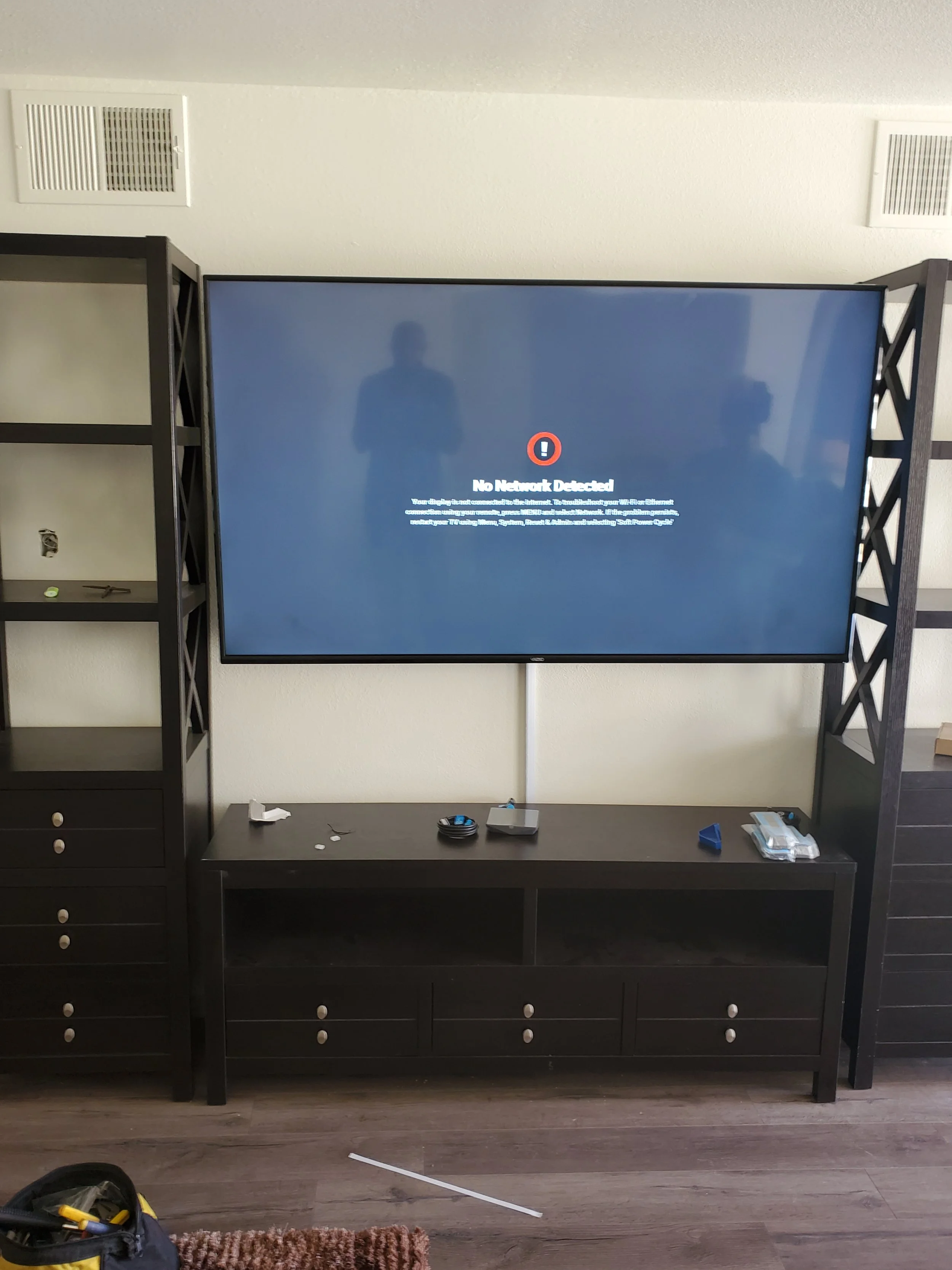 Wall-mounted television with sleek surface-mounted cord channel concealing all power and HDMI cables along the wall for a clutter-free look.