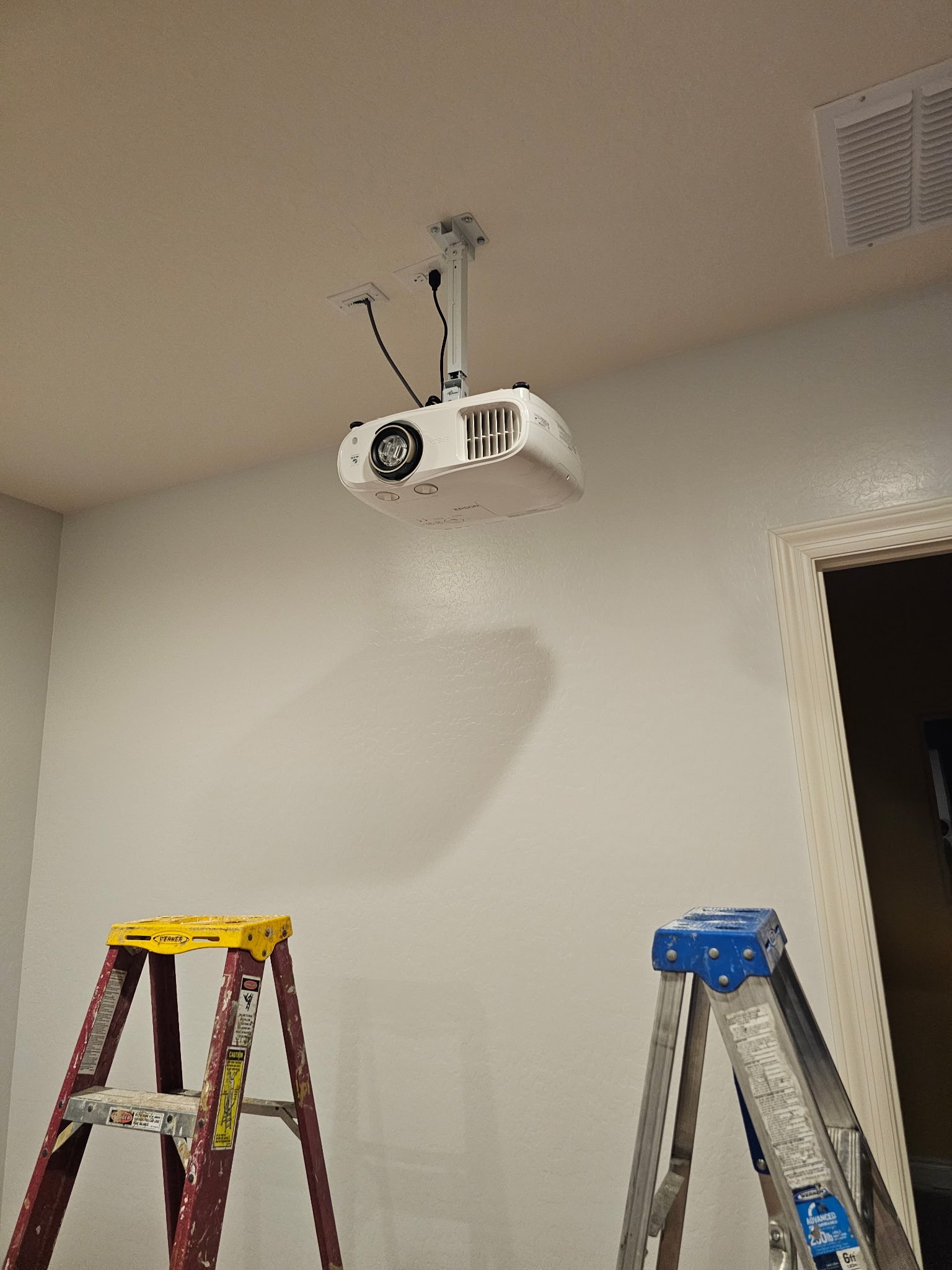 Epson Home Cinema projector mounted in the ceiling for a seamless, high‑quality viewing experience with expert installation.