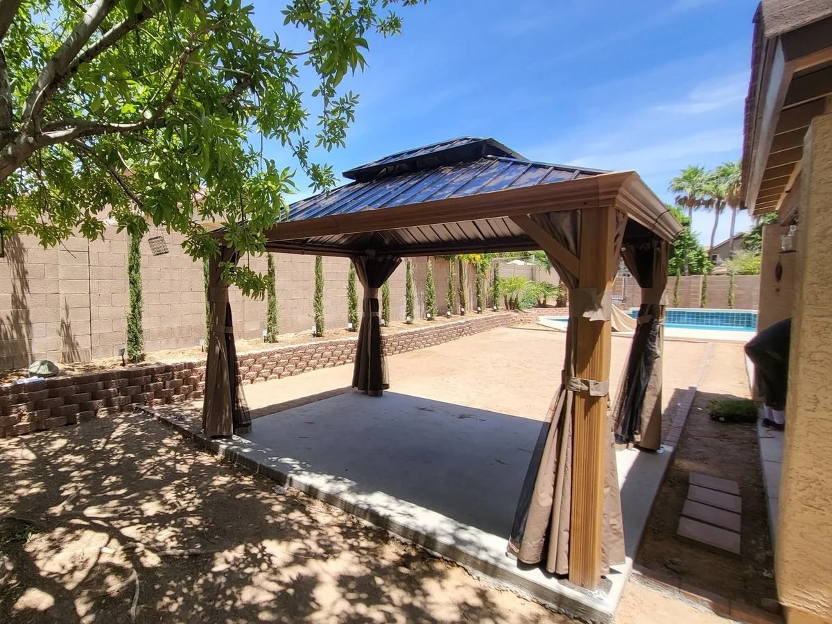 Finished gazebo installed beside a pool in a Phoenix backyard by Helping Hands