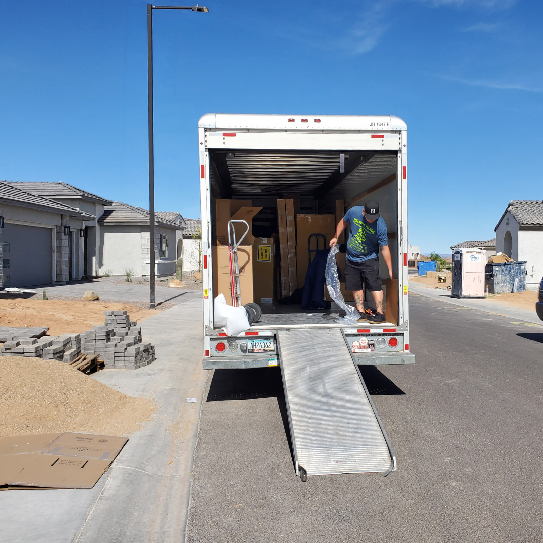 Helping Hands Household Solutions full service flat-rate local residential movers with a moving truck and dolly.
