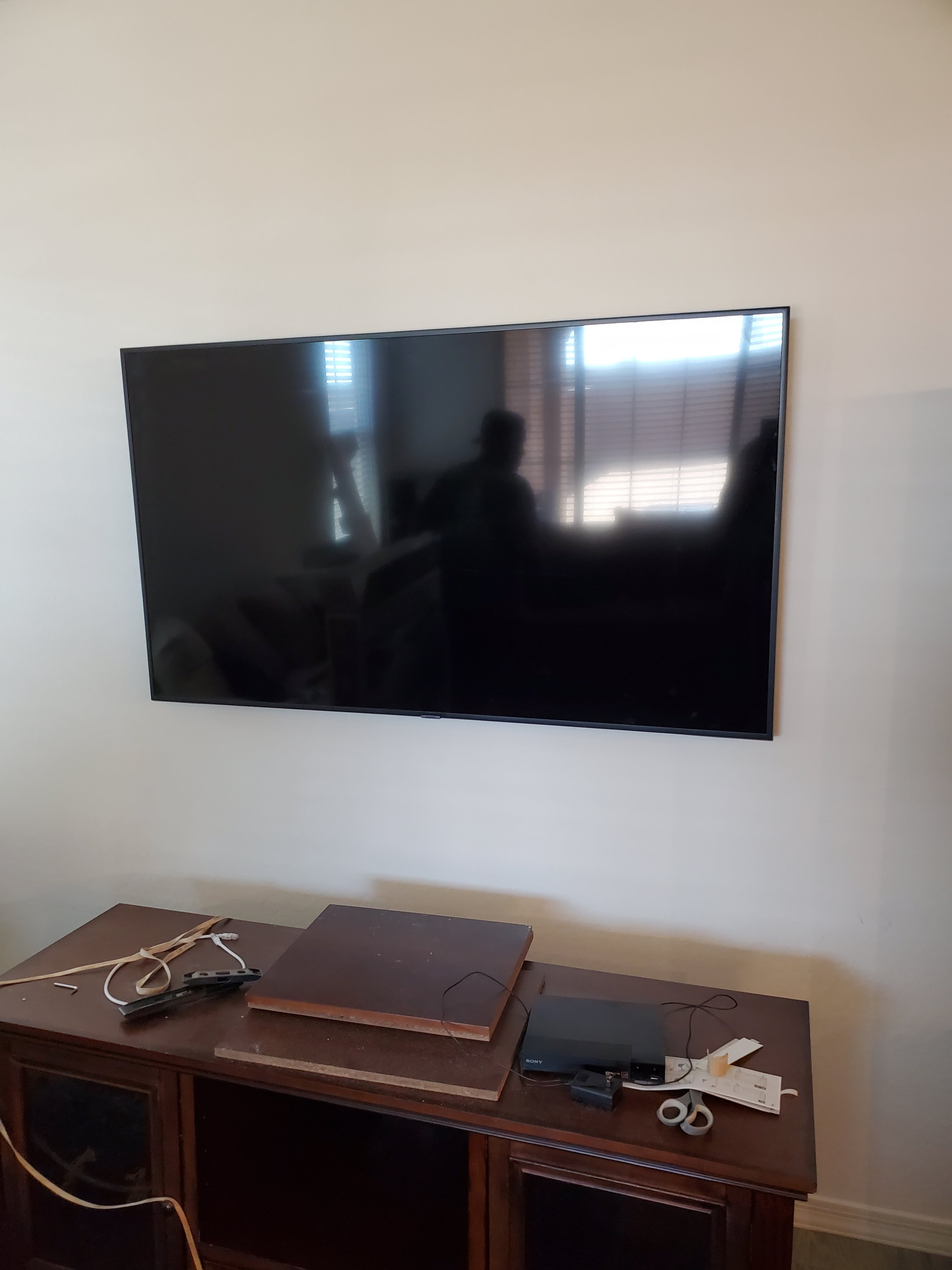 Medium‑sized TV mounted on drywall in a Phoenix bedroom, providing secure installation and optimized viewing comfort.