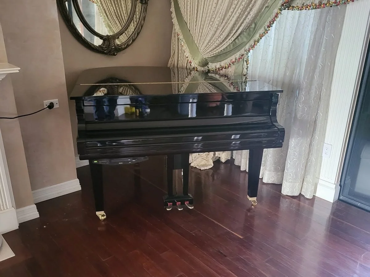 Baby grand piano moved and placed in a Phoenix home
