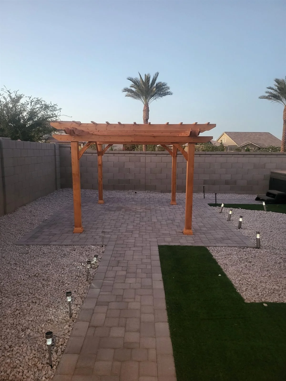 Sunsets look better under cedar: pergola on a paver patio