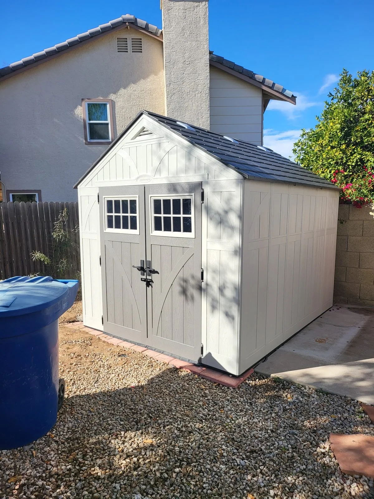 Suncast Tremont resin storage shed assembled in a Phoenix, AZ side yard by Helping Hands Household Solutions
