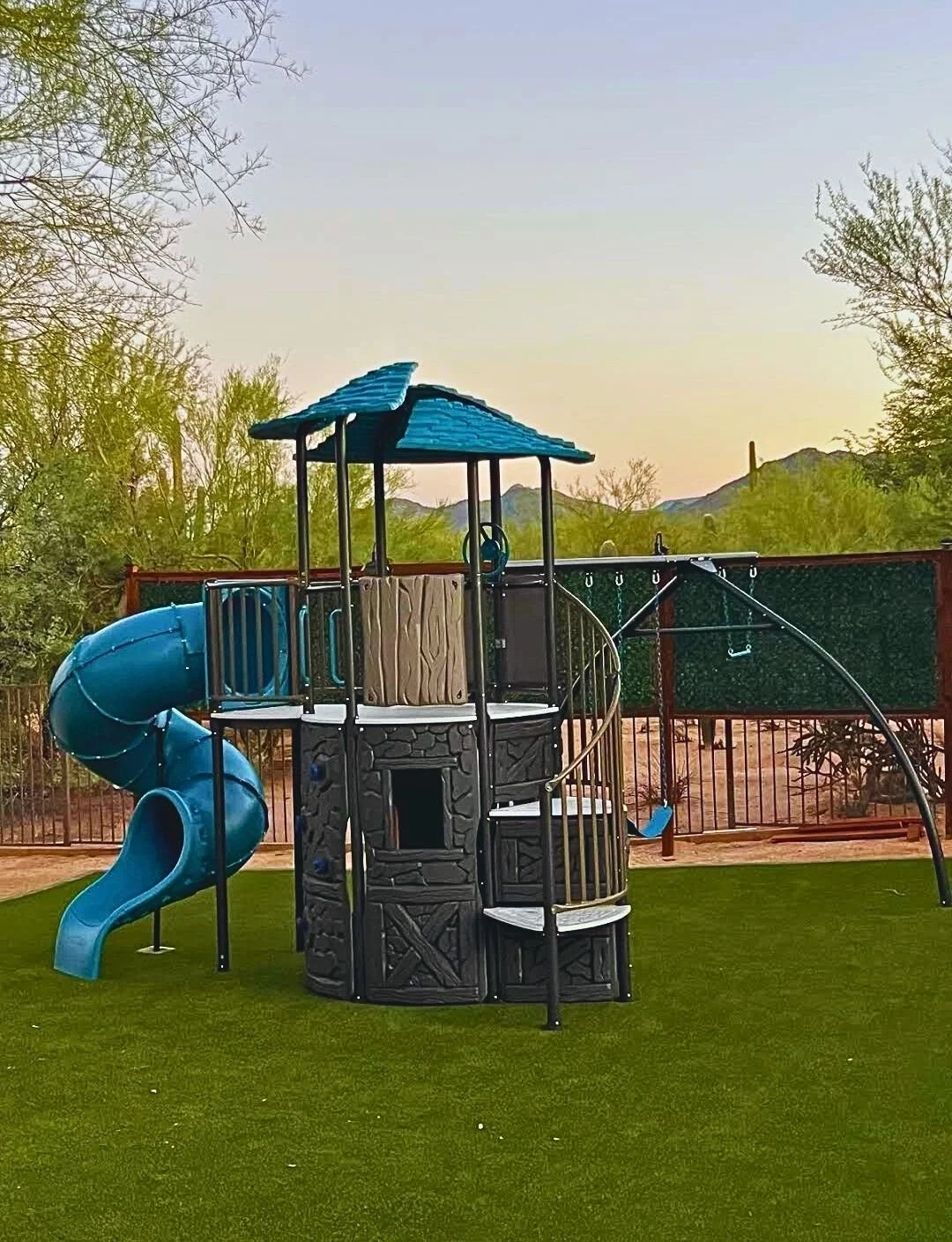 lifetime adventure castle swing set assembled in Phoenix backyard.