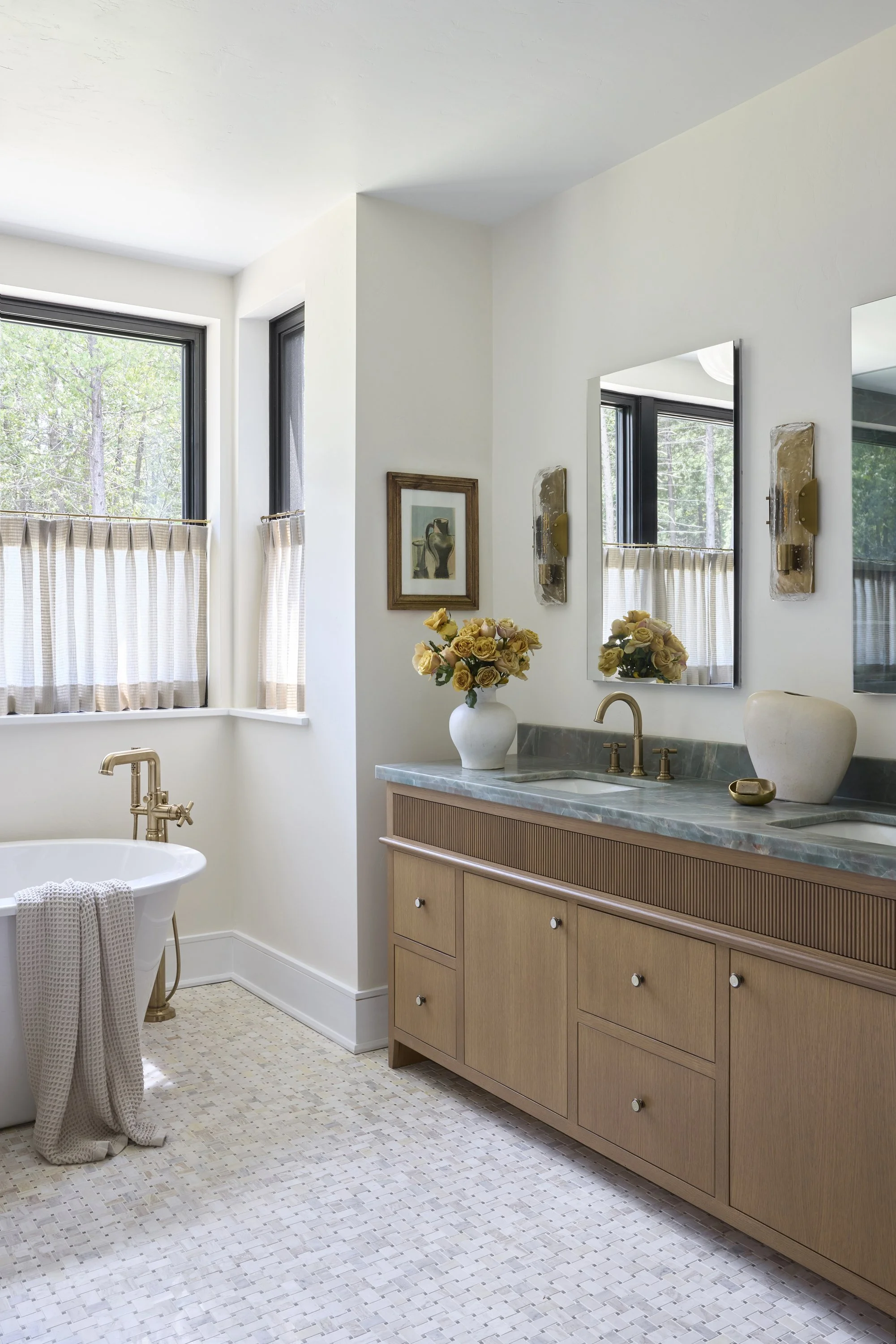 Luxury primary bathroom with premium finishes and fixtures. Beautiful natural light.